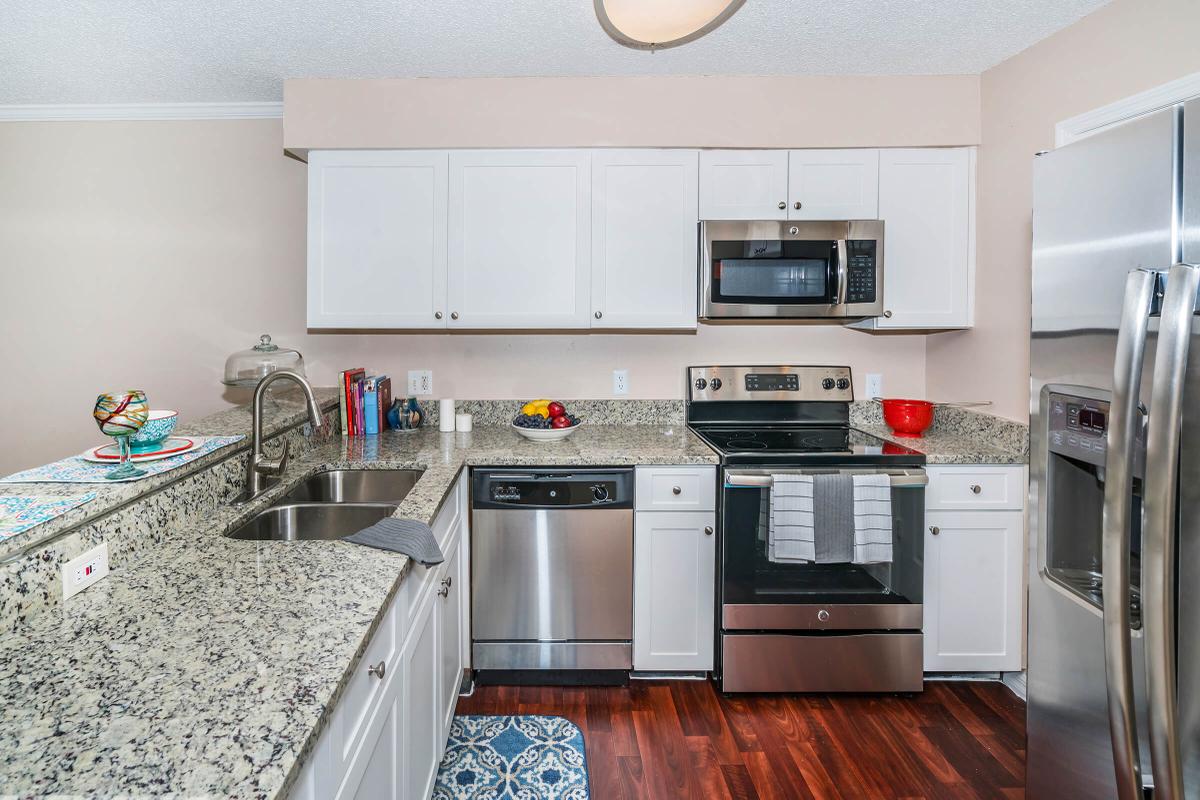 a kitchen with a stove and a refrigerator