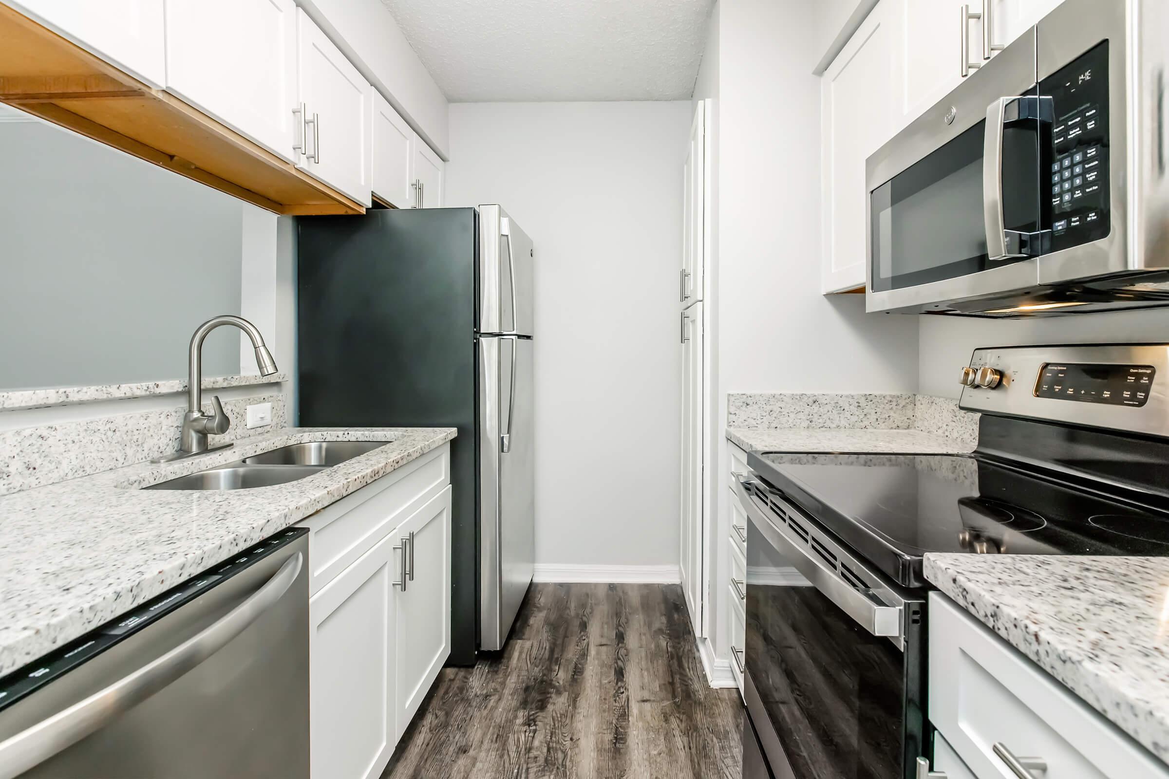 a large kitchen with stainless steel appliances