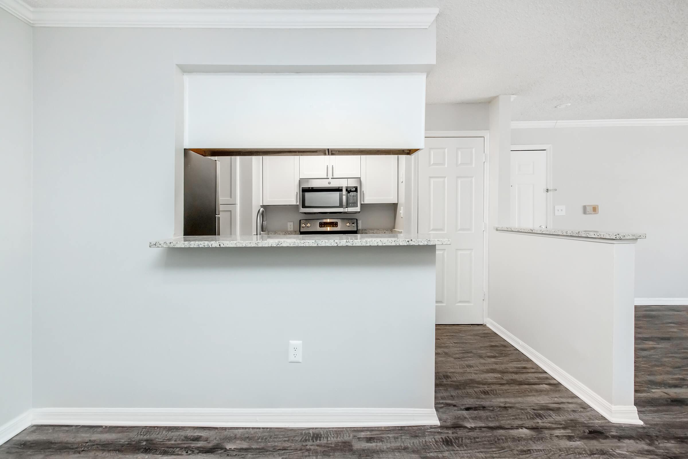 a kitchen with a sink and a refrigerator