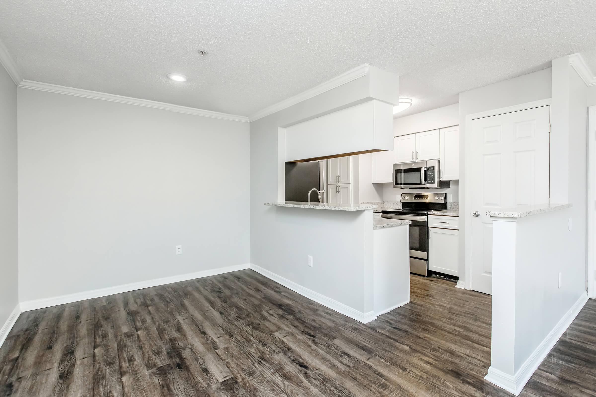 a kitchen with a wooden floor