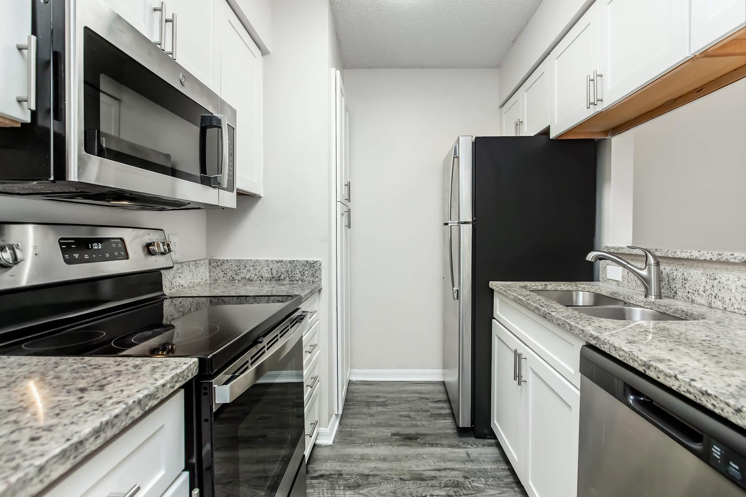 a modern kitchen with stainless steel appliances