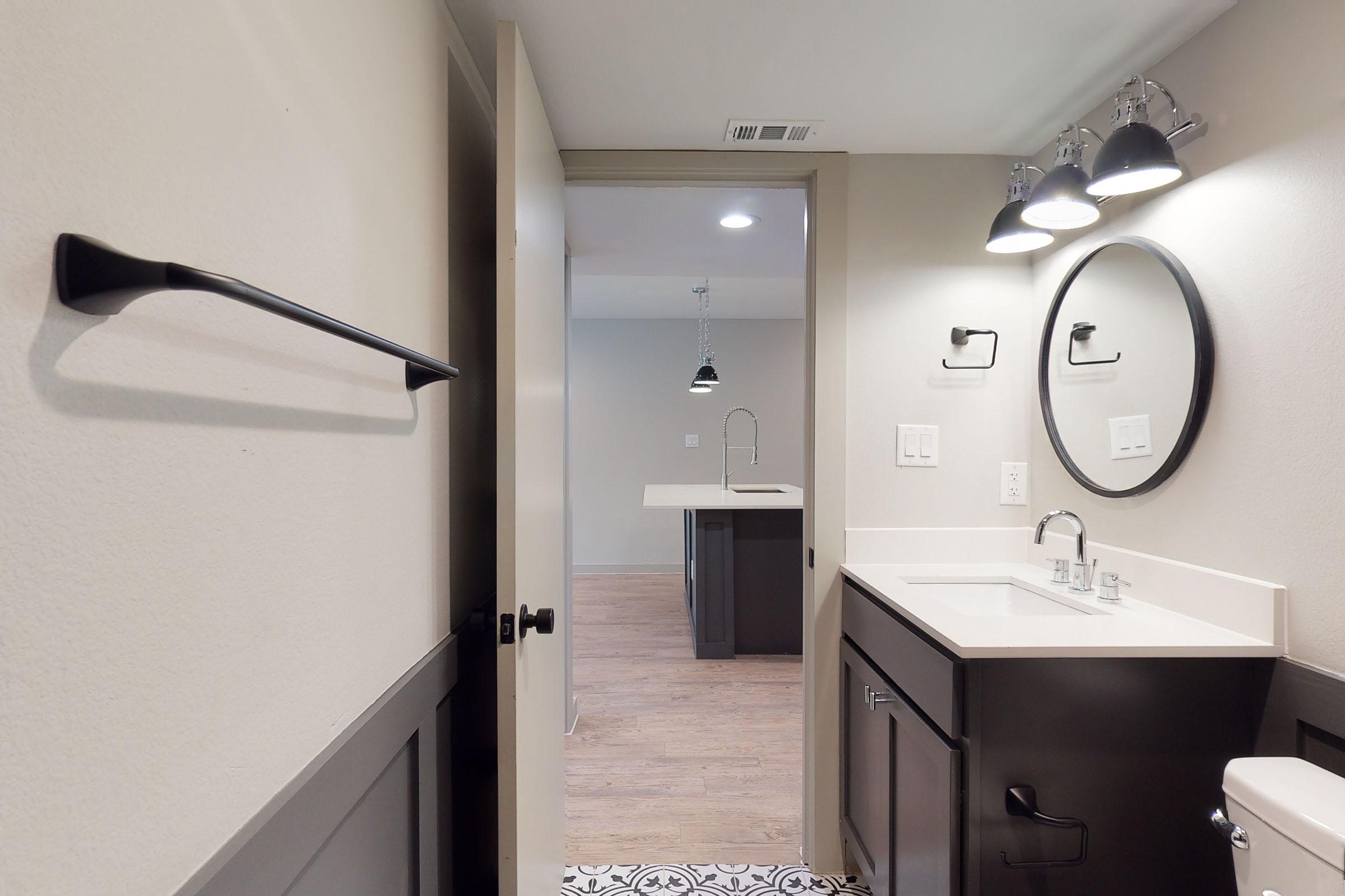 bathroom with black and white floors