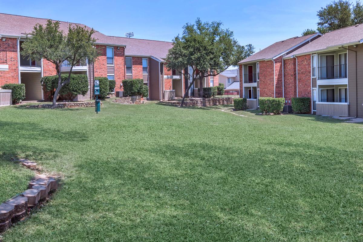 a large lawn in front of a house