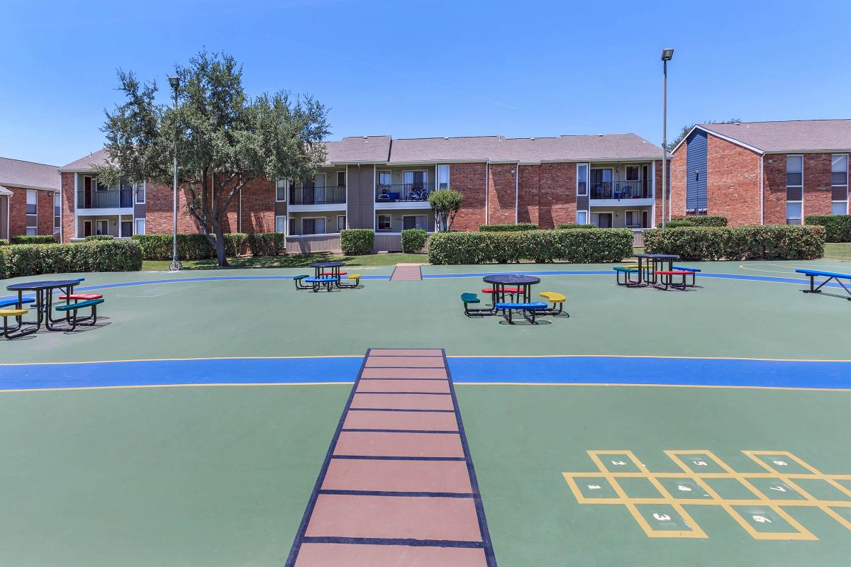 an empty parking lot in front of a building