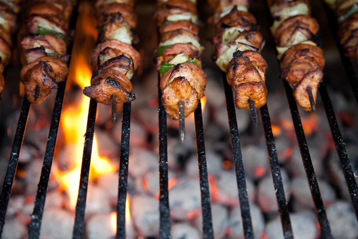 a row of food on a grill