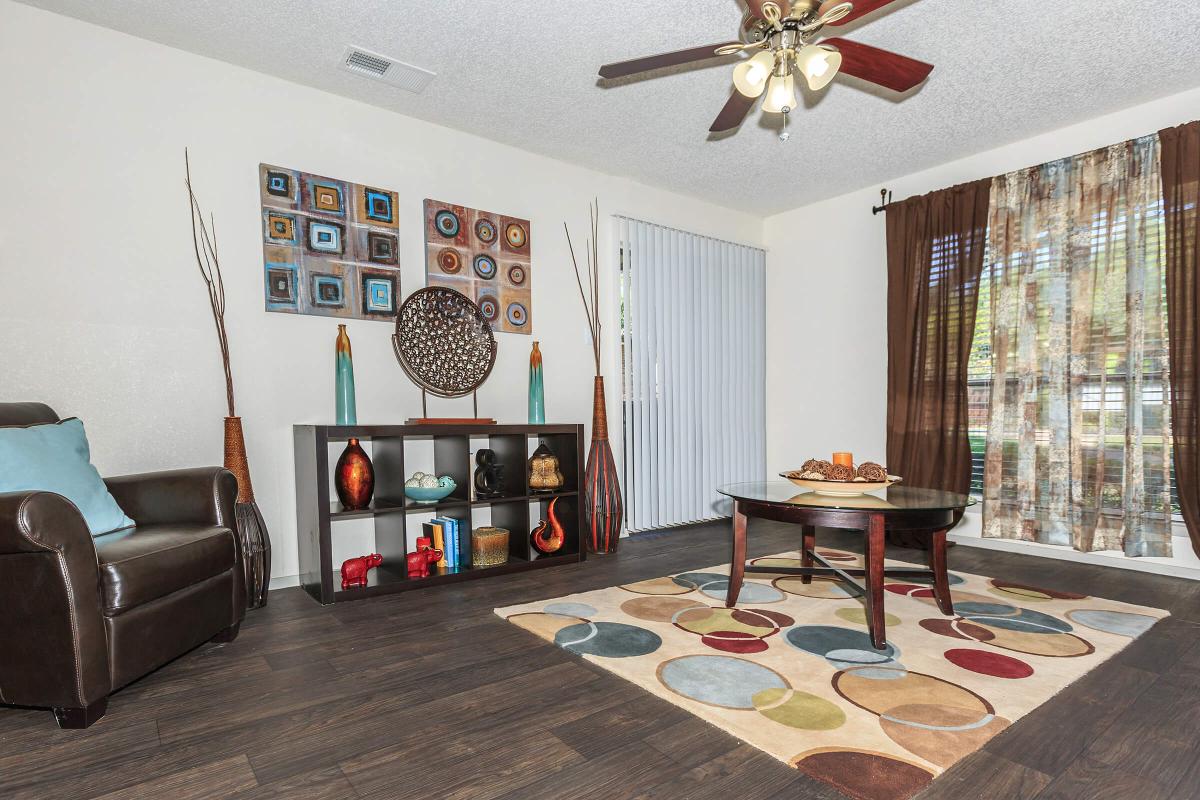 a living room filled with furniture and a fire place