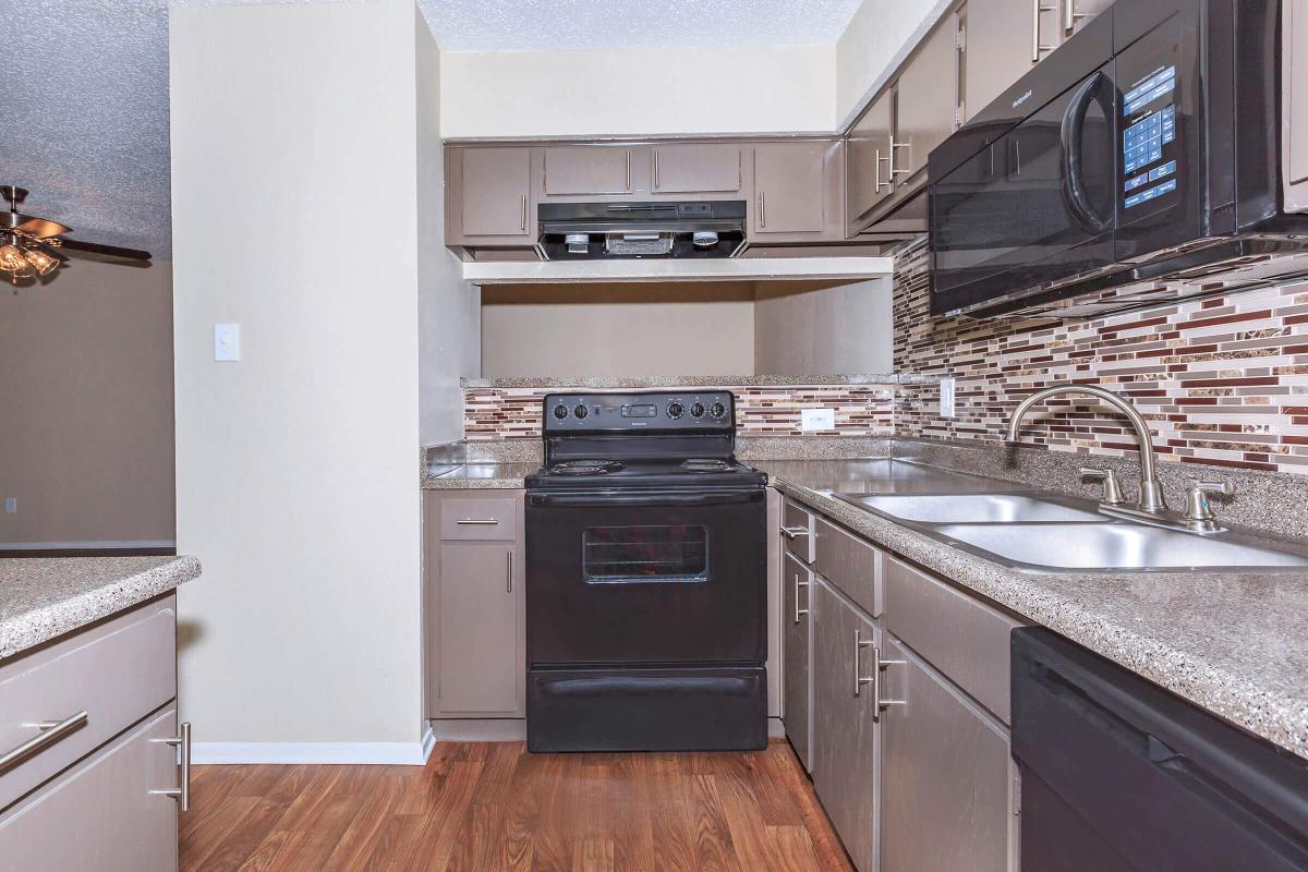 a modern kitchen with stainless steel appliances