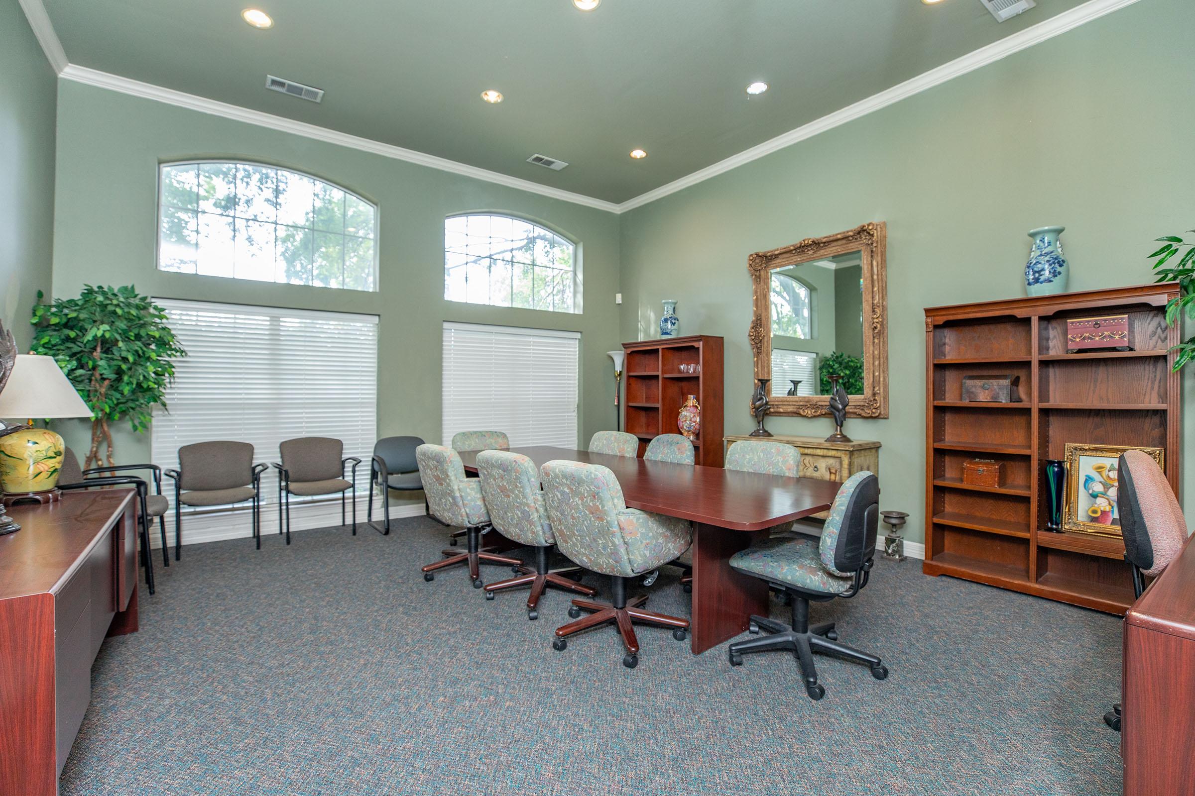 a living room filled with furniture and a large window