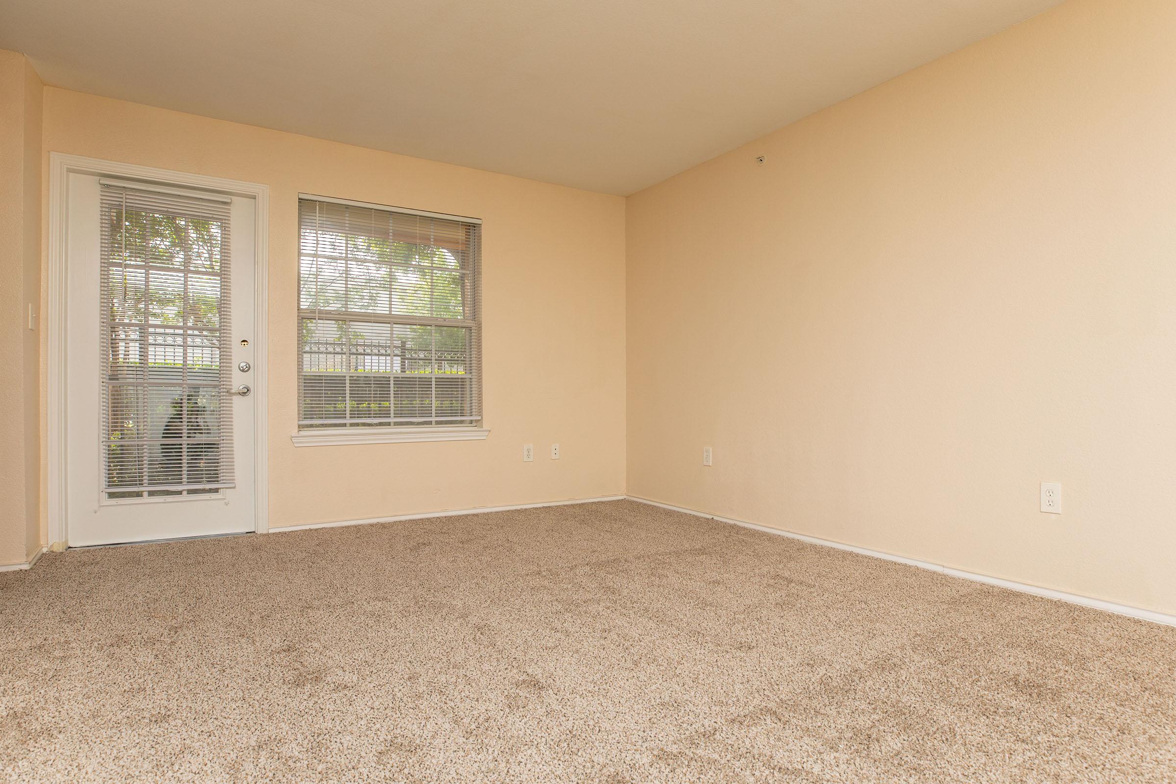 a bedroom with a large window