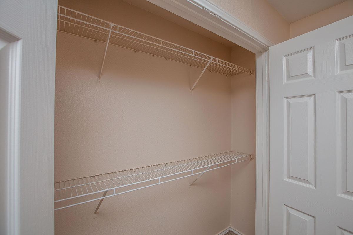 a bedroom with a bed and a mirror