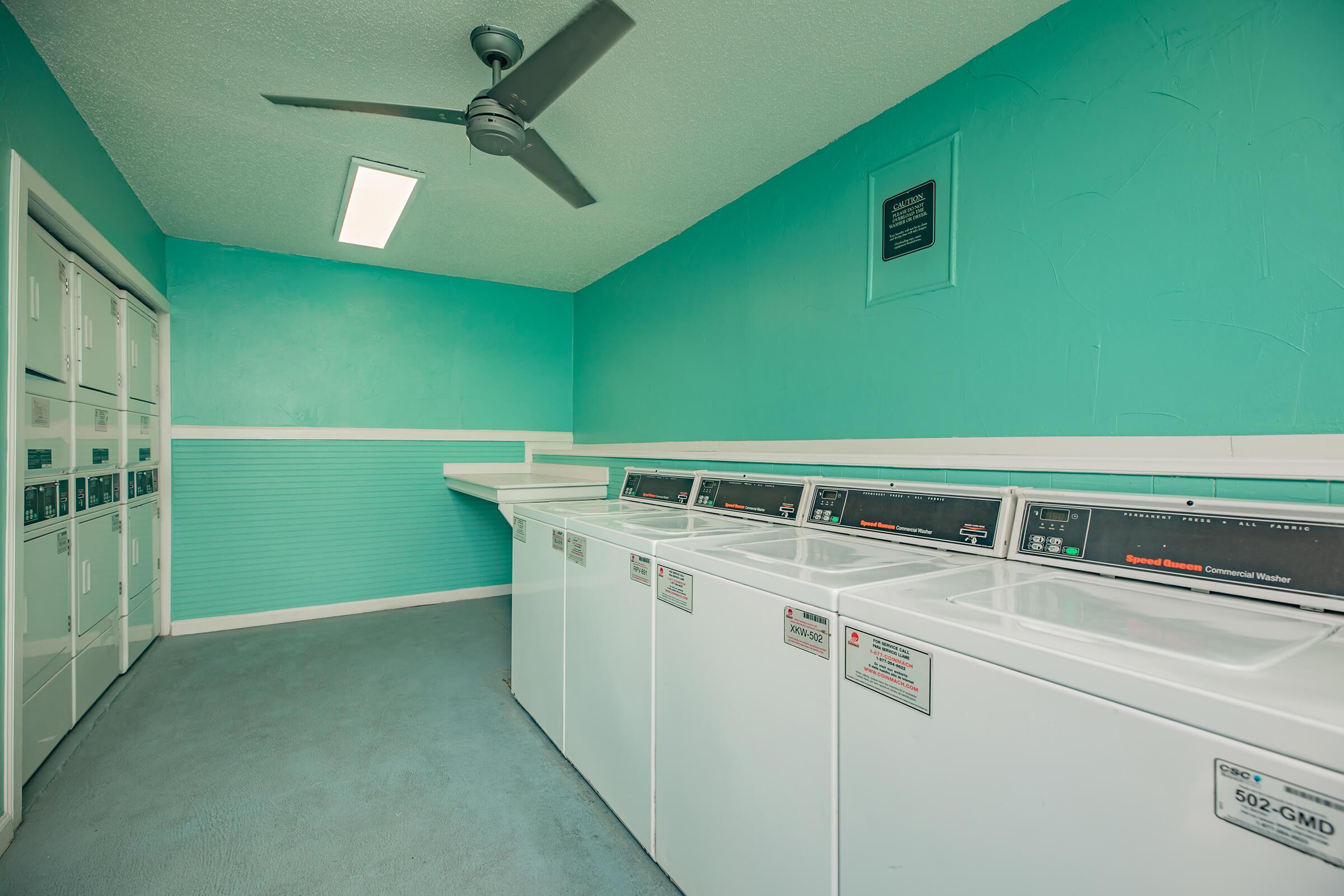 a kitchen with green walls