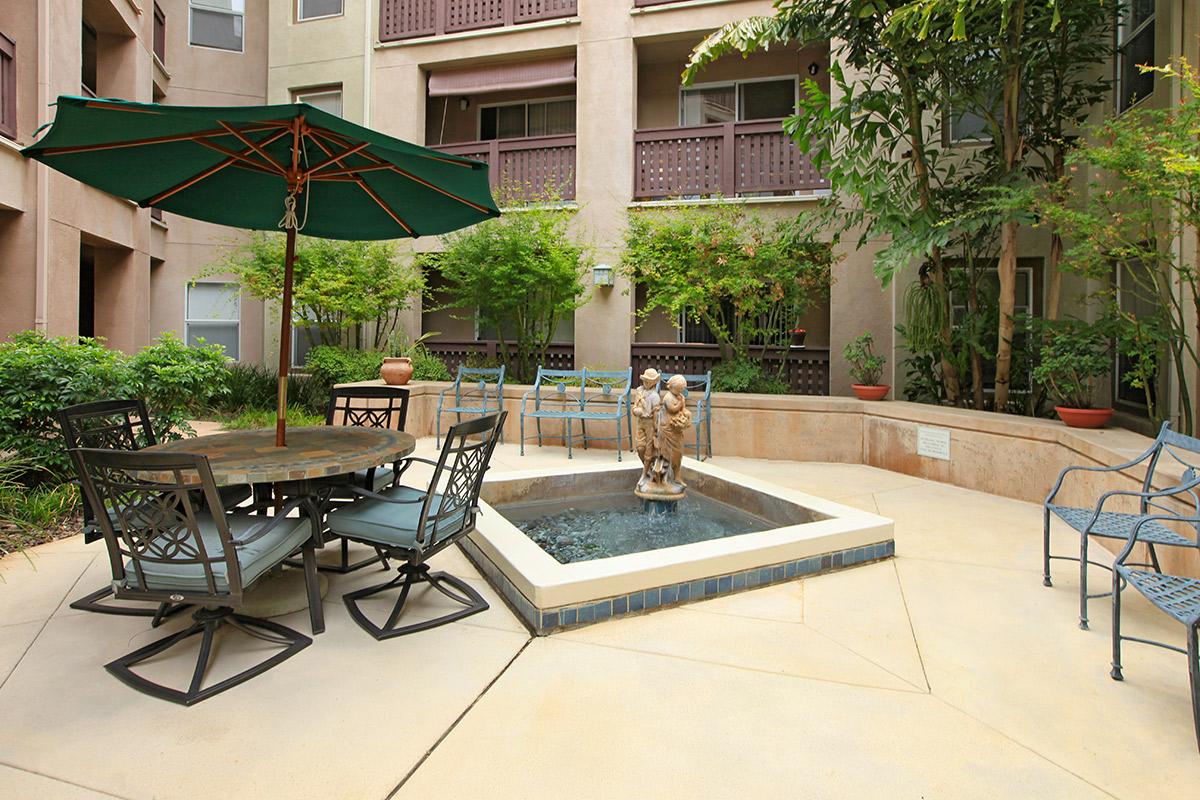 Harmony Creek Senior Apartment Homes water feature with chairs