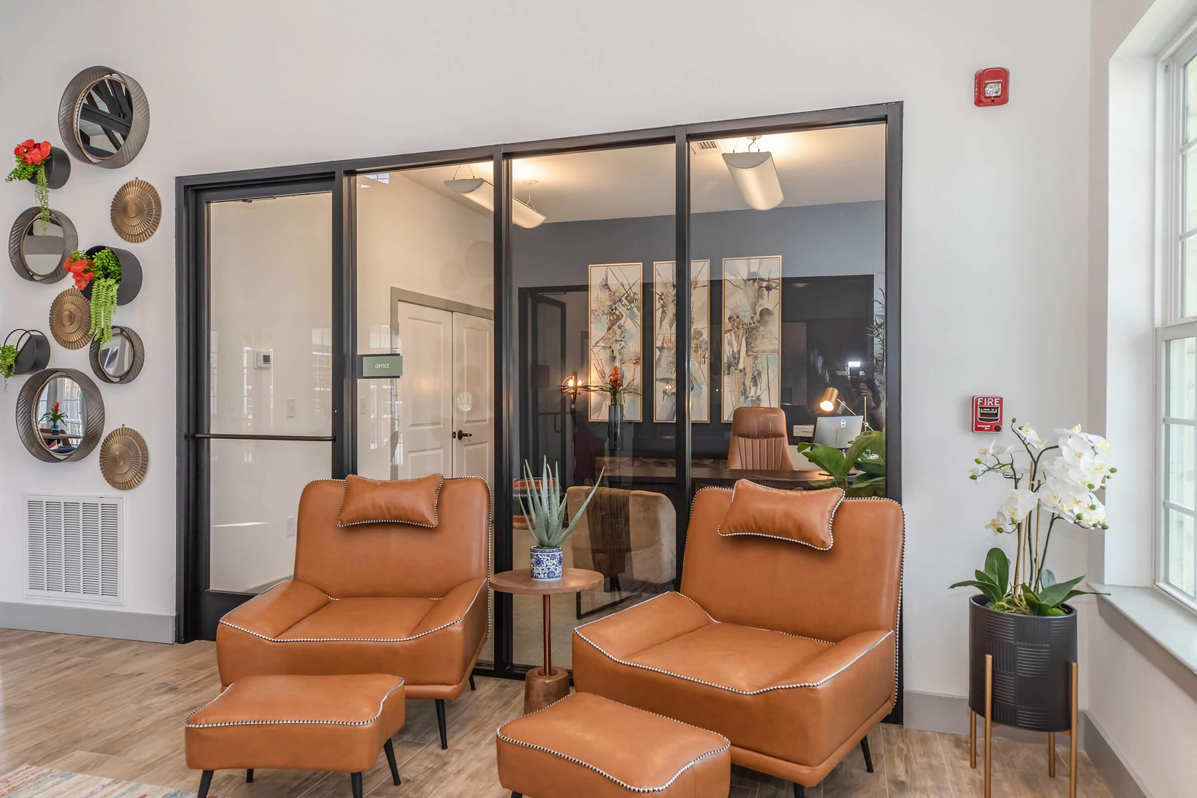 a living room filled with furniture and a large window