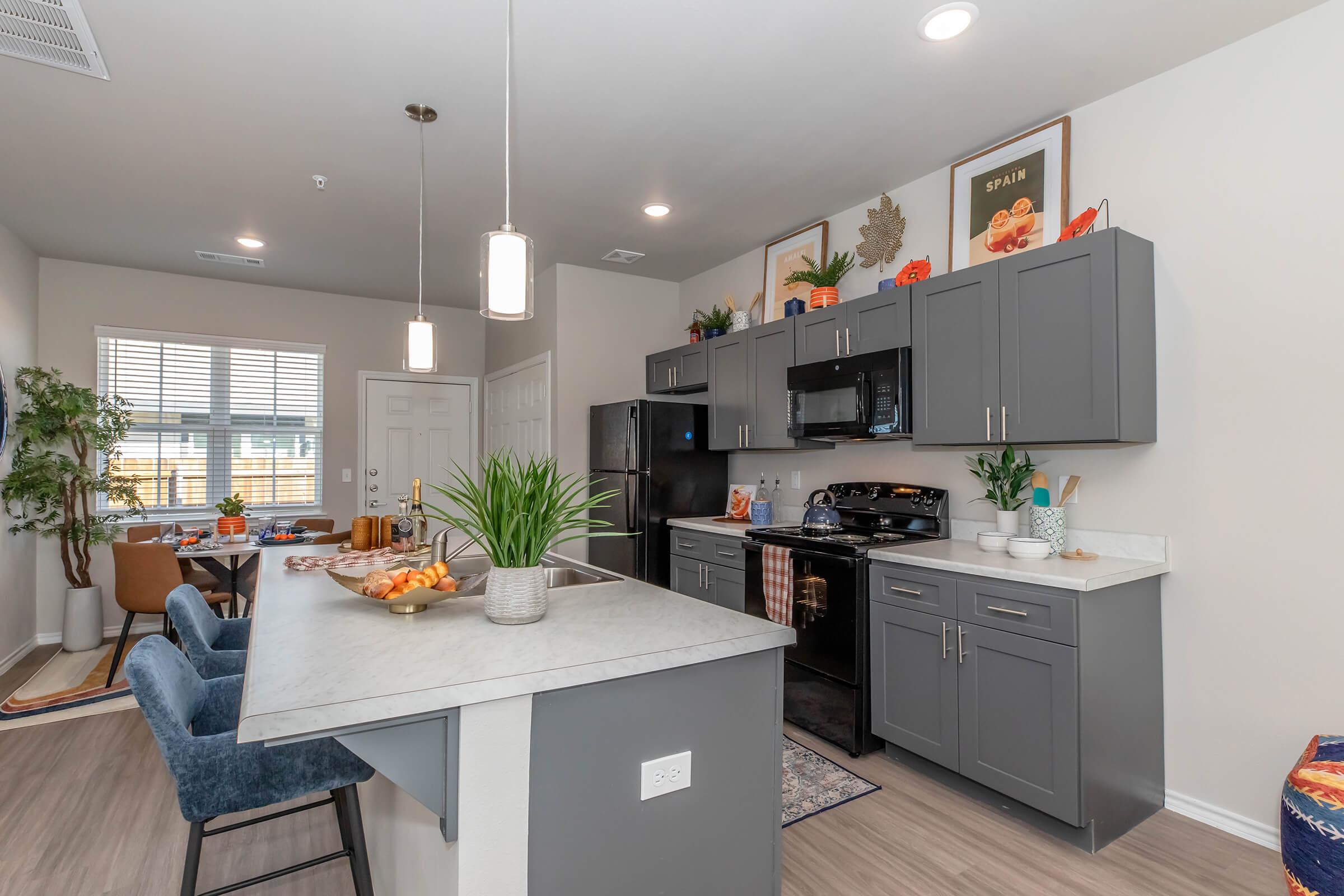 a kitchen with an island in the middle of a room