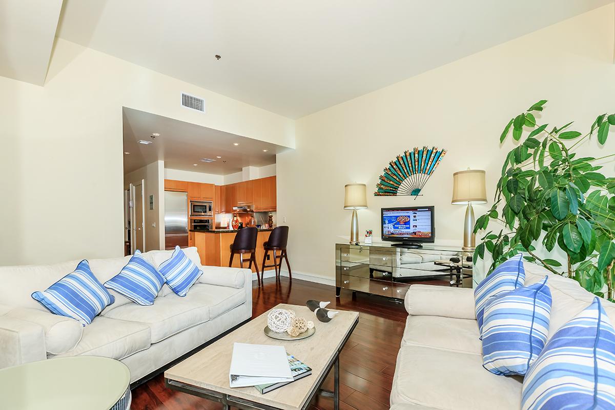 a living room filled with furniture and a fireplace