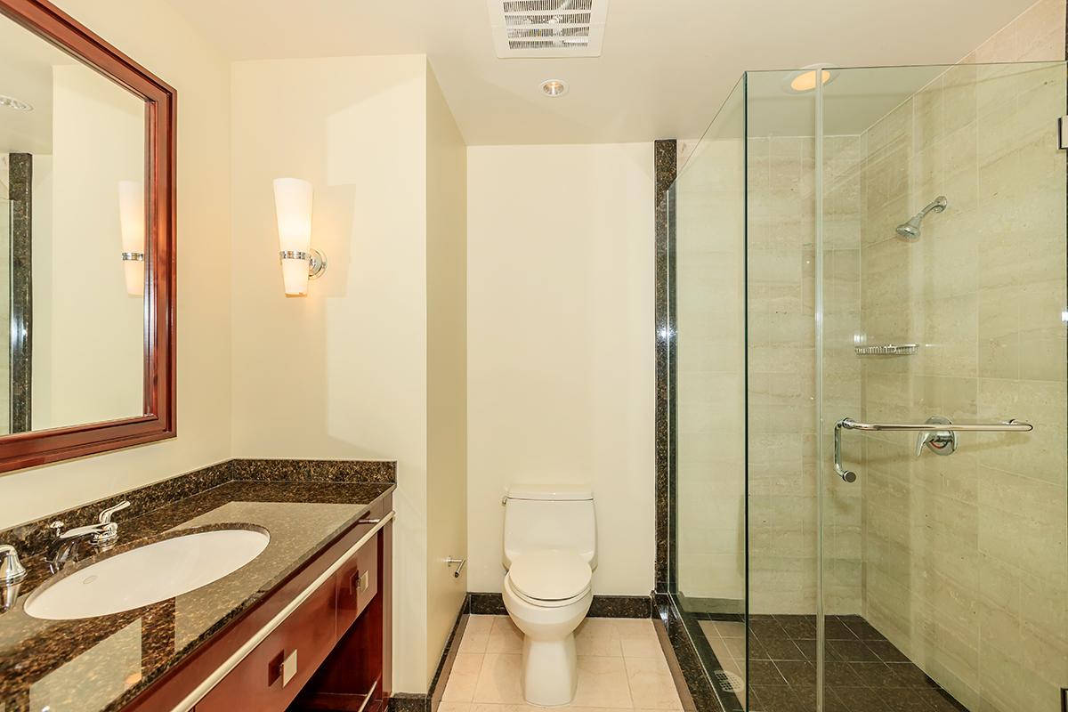 a room with a sink and a mirror