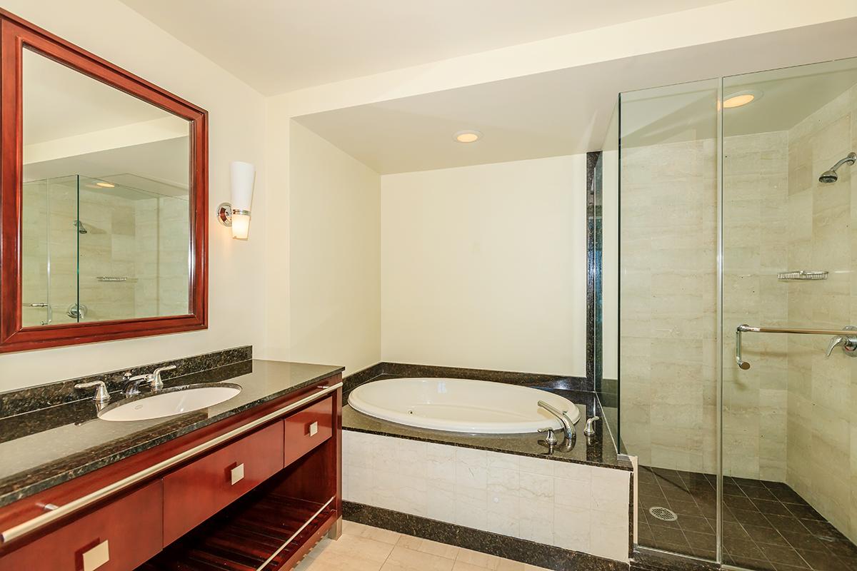 a bedroom with a large mirror