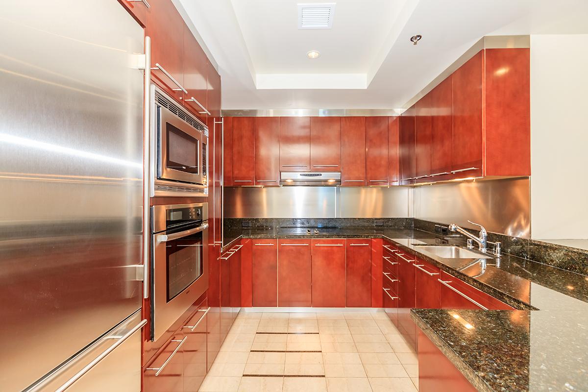 a large kitchen with stainless steel appliances