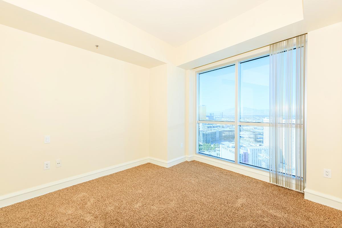 a bedroom with a large window