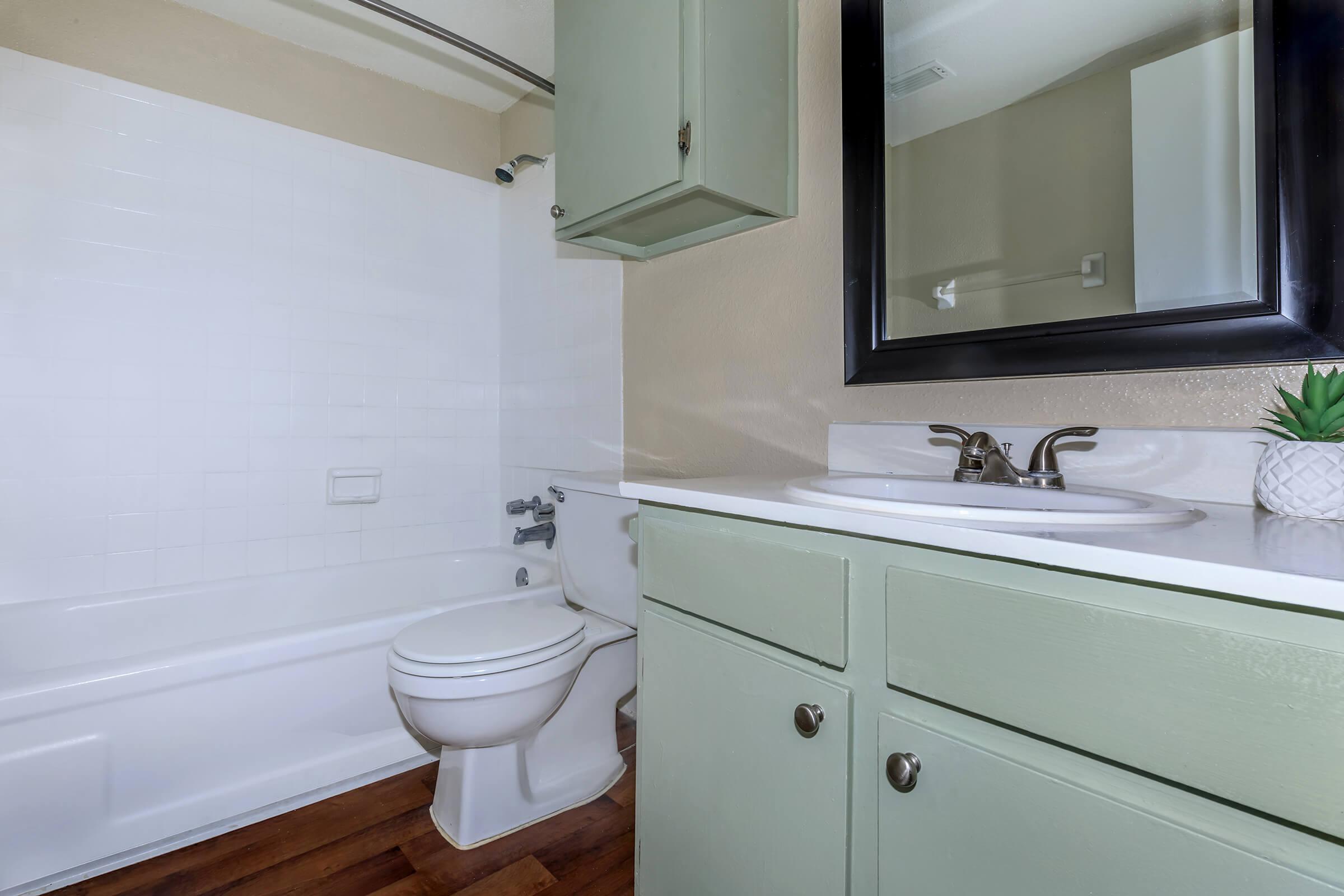 a kitchen with a sink and a mirror