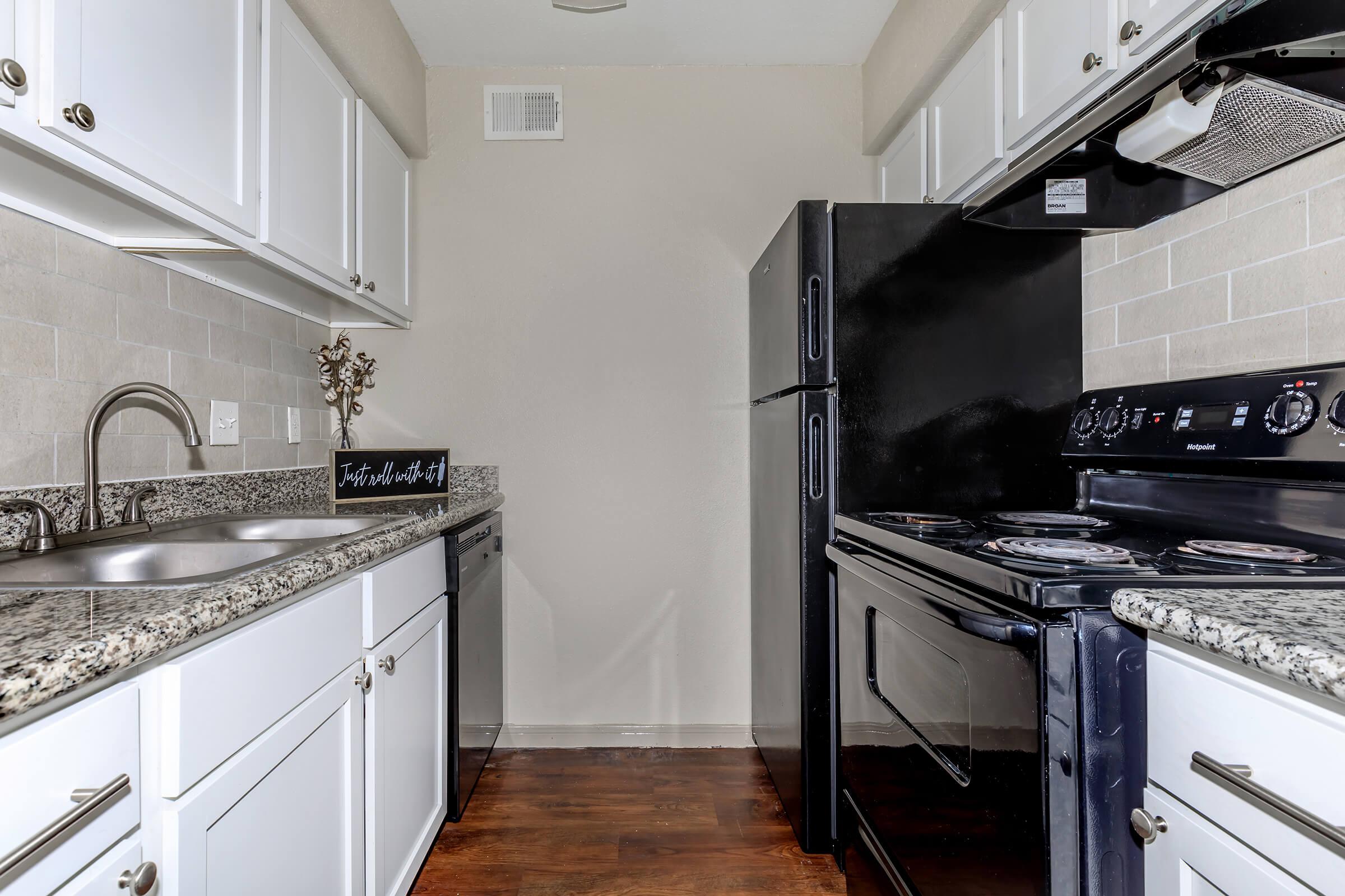 a kitchen with a stove top oven