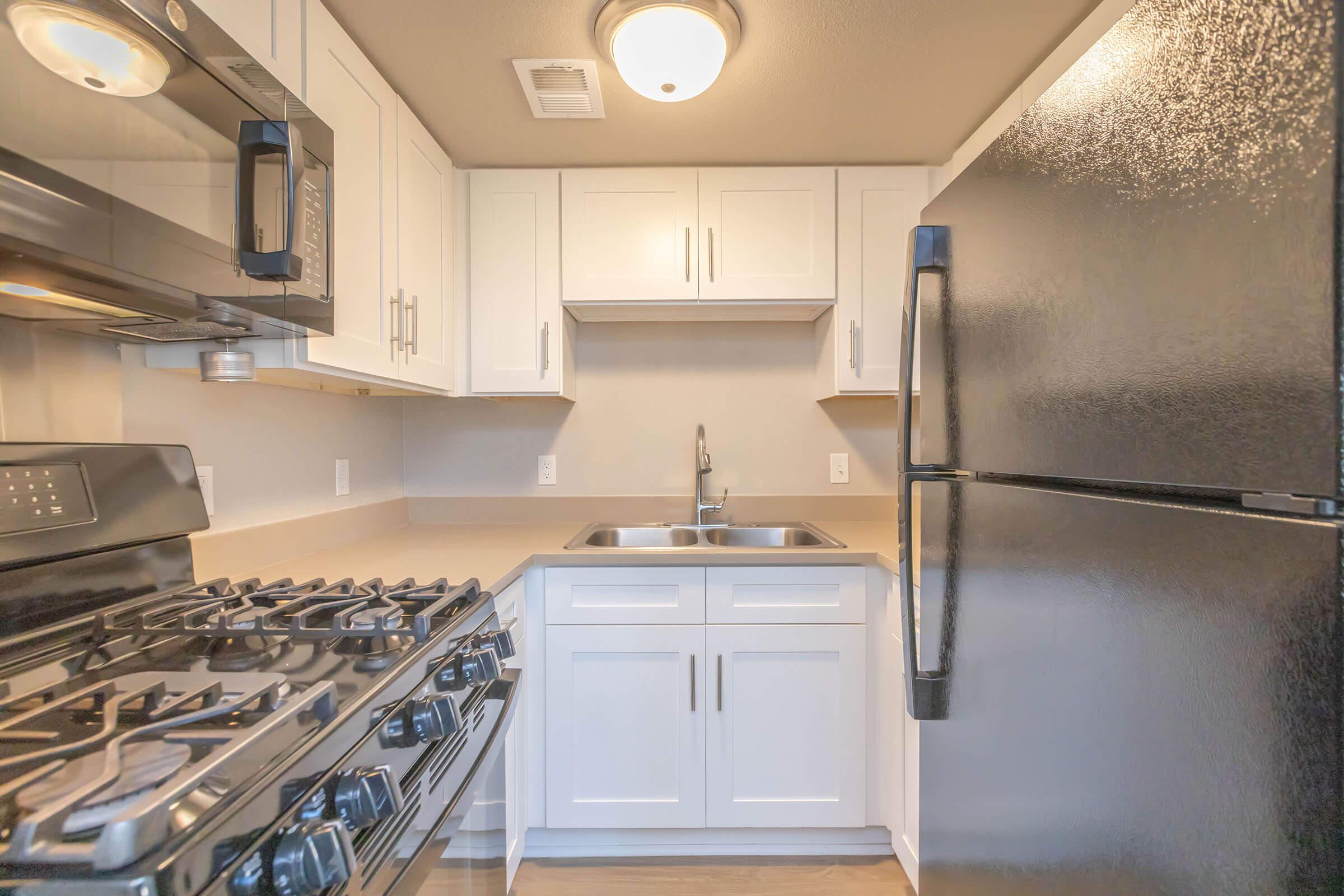 a kitchen with a stove top oven