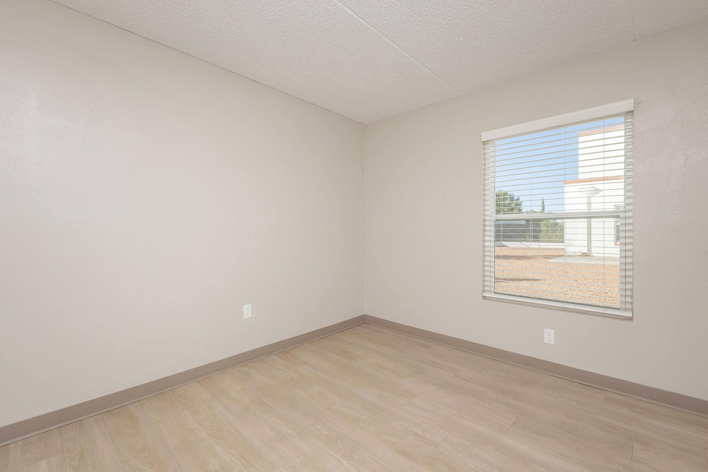 a bedroom with a large window