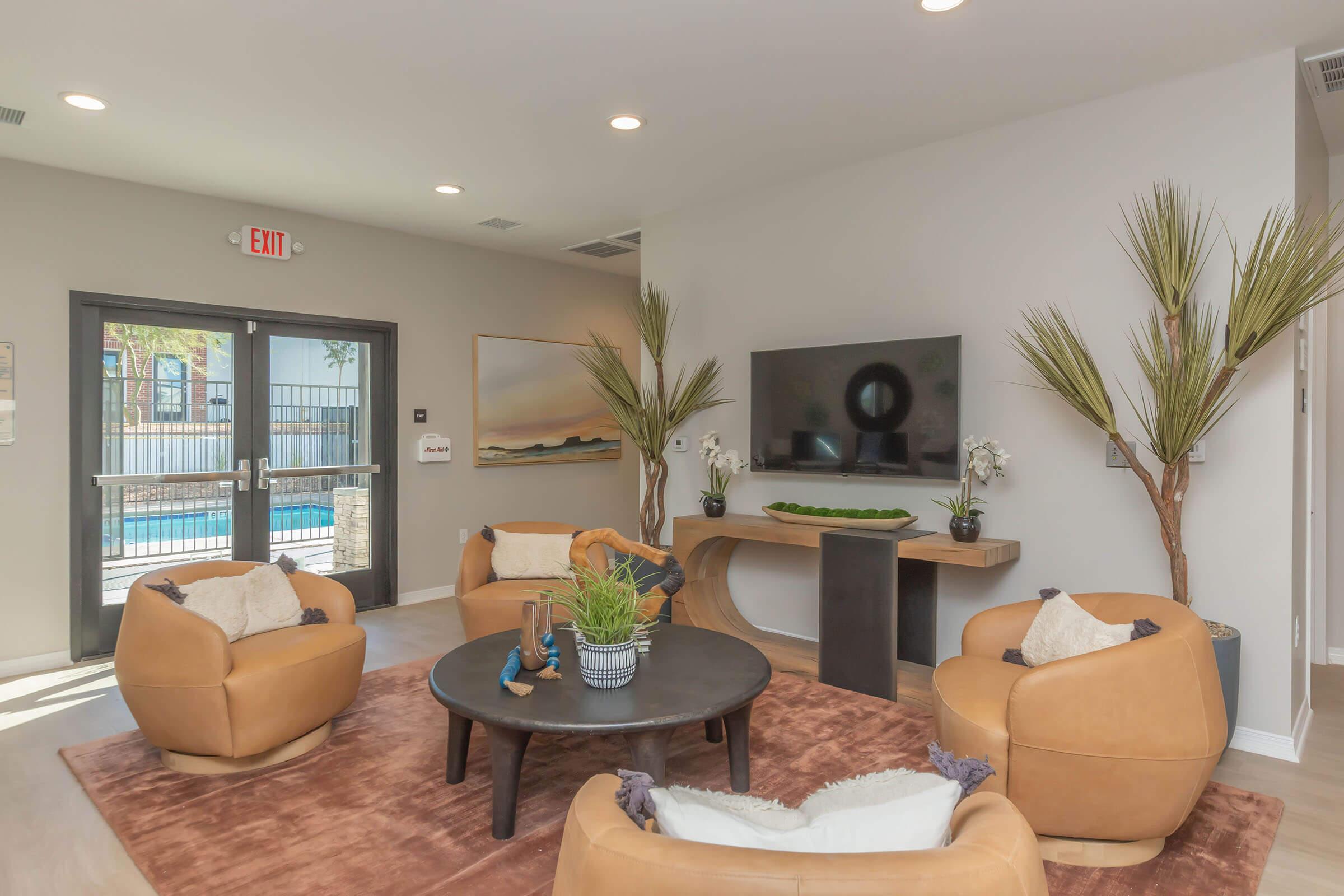 a living room filled with furniture and a flat screen tv