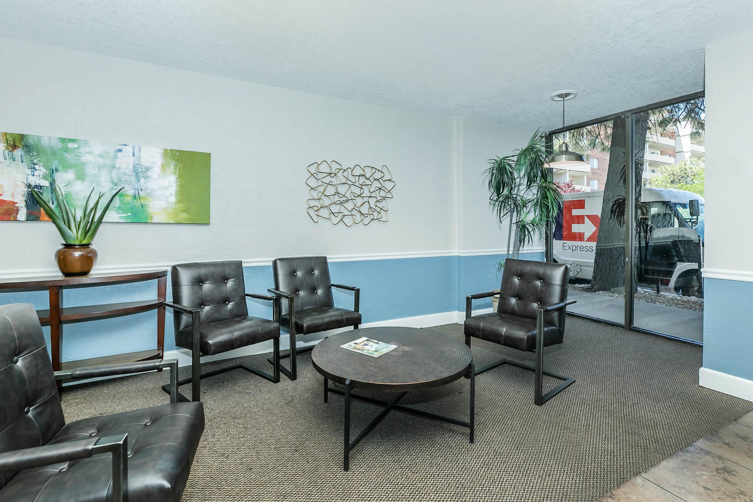 a living room filled with furniture and a large window