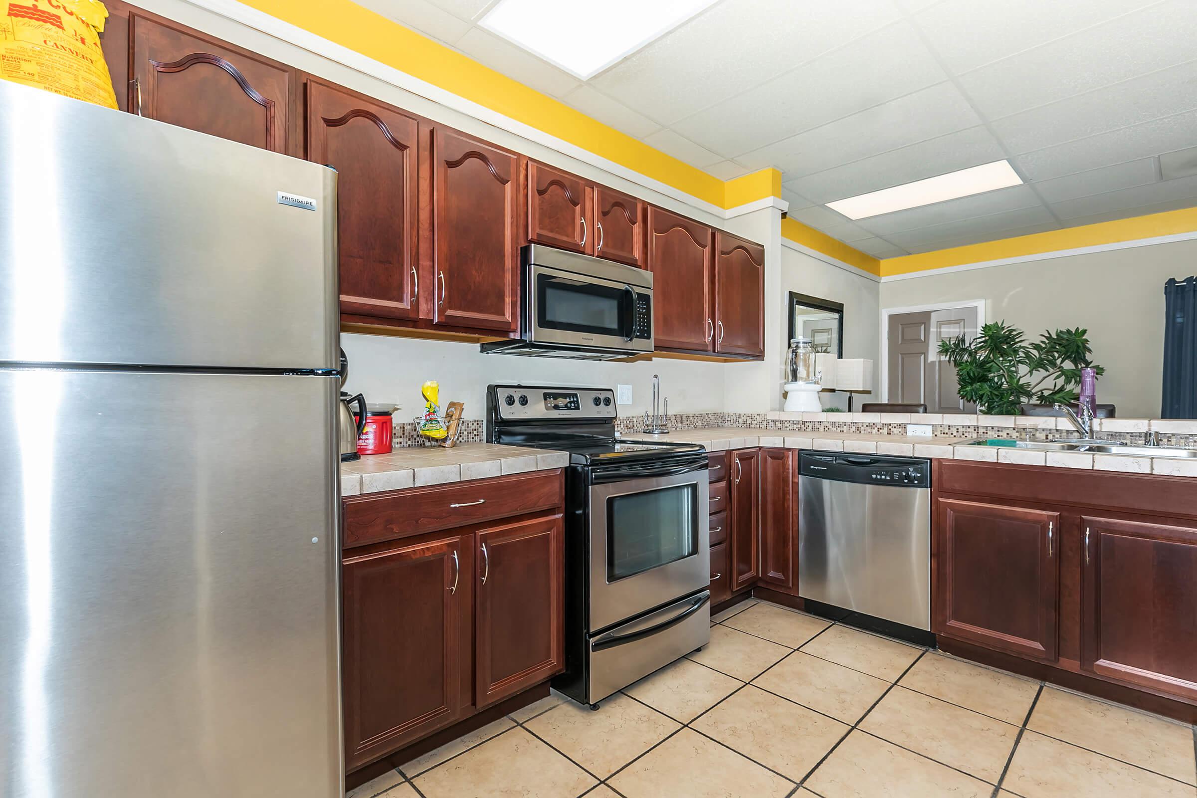 a stainless steel refrigerator in a kitchen