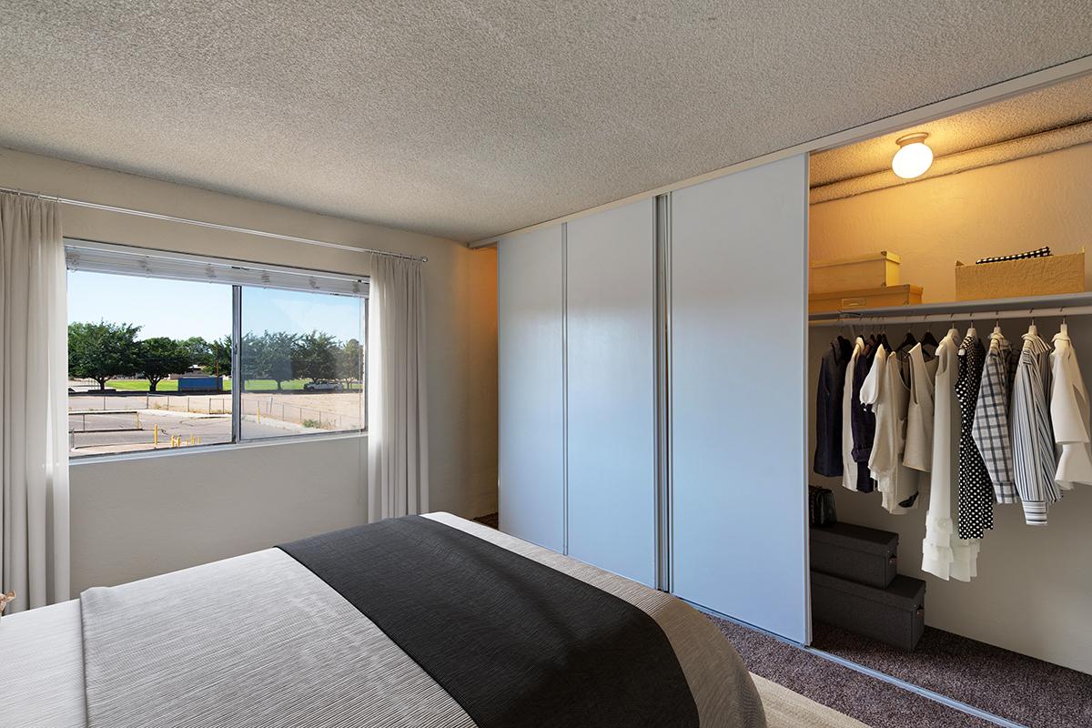 a bedroom with a large bed in a hotel room