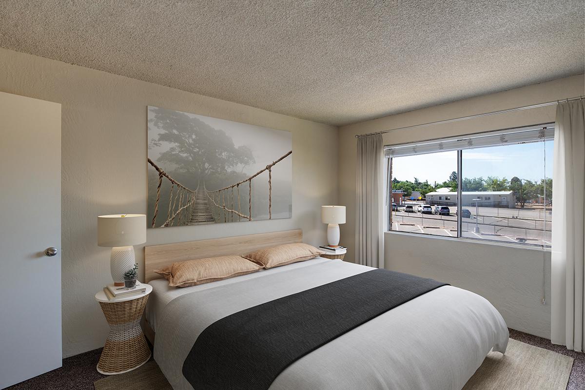 a bedroom with a large bed in a hotel room