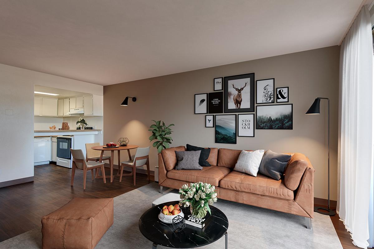 a living room filled with furniture and a flat screen tv