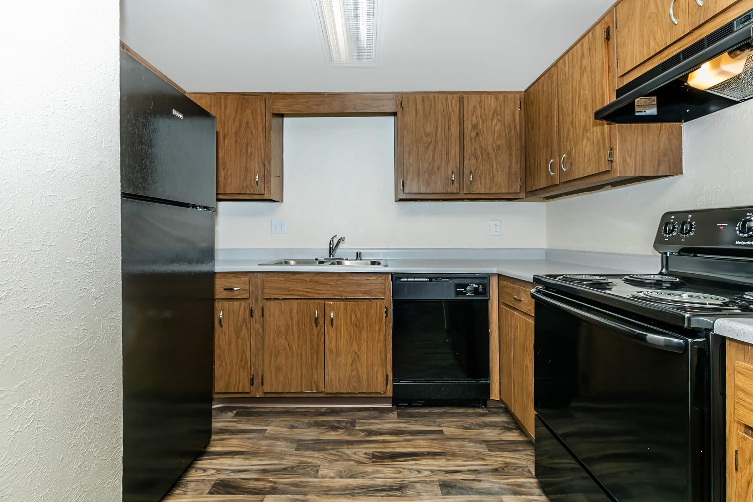 a kitchen with a stove and a refrigerator