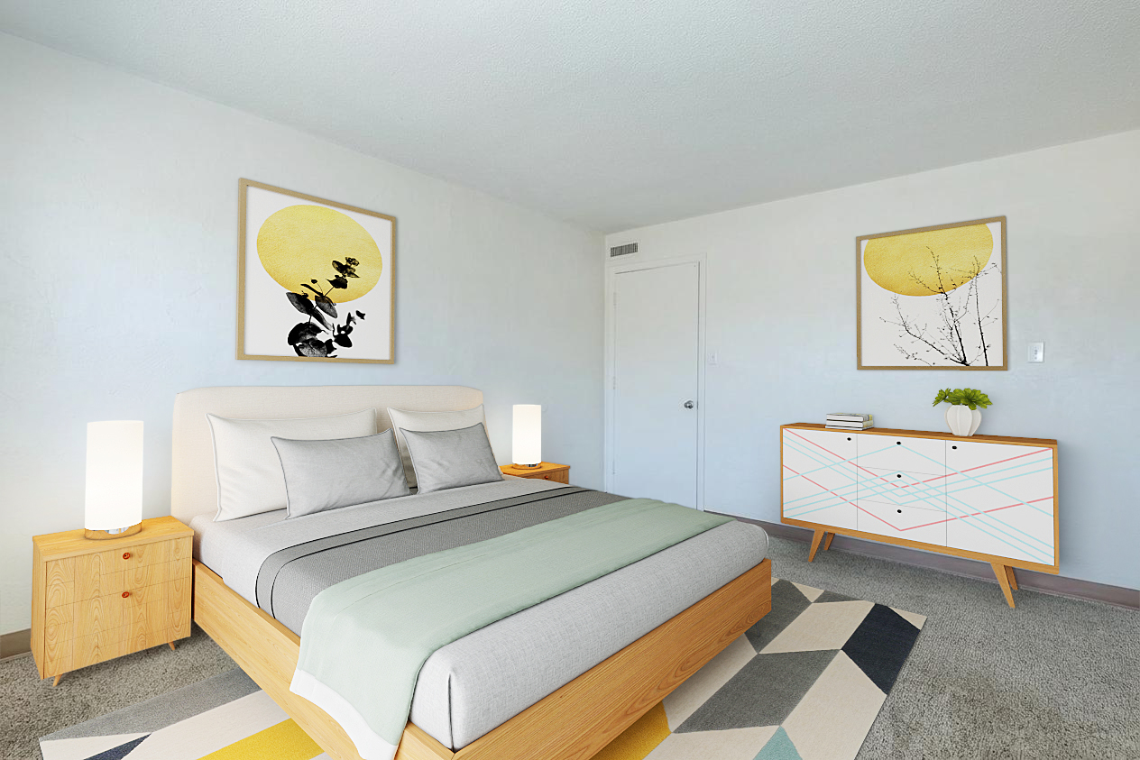 A modern bedroom featuring a light-colored bed with gray and striped bedding, bedside tables with lamps, and a contemporary dresser. Two framed abstract artworks hang on the walls, and a colorful geometric rug lies on the floor, creating a bright and inviting atmosphere.