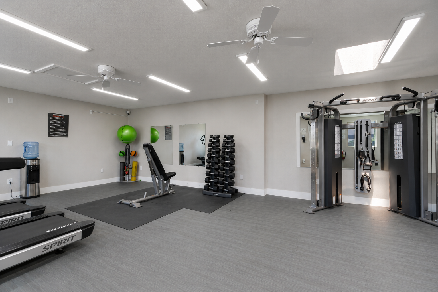 Experience a vibrant fitness oasis with state-of-the-art equipment and a bright, inviting atmosphere, perfect for energizing your daily workout routine right at your doorstep.
