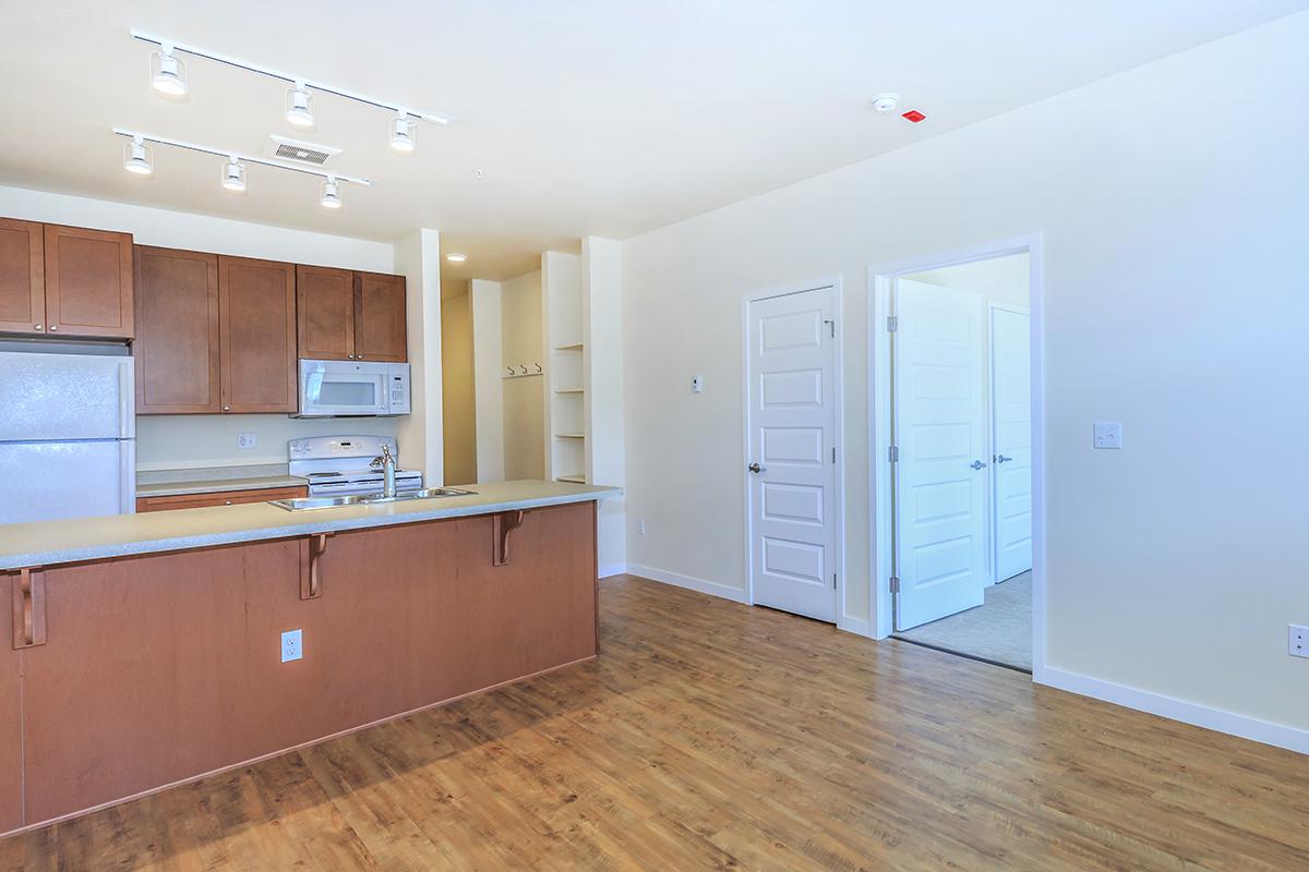 a kitchen with a wood floor