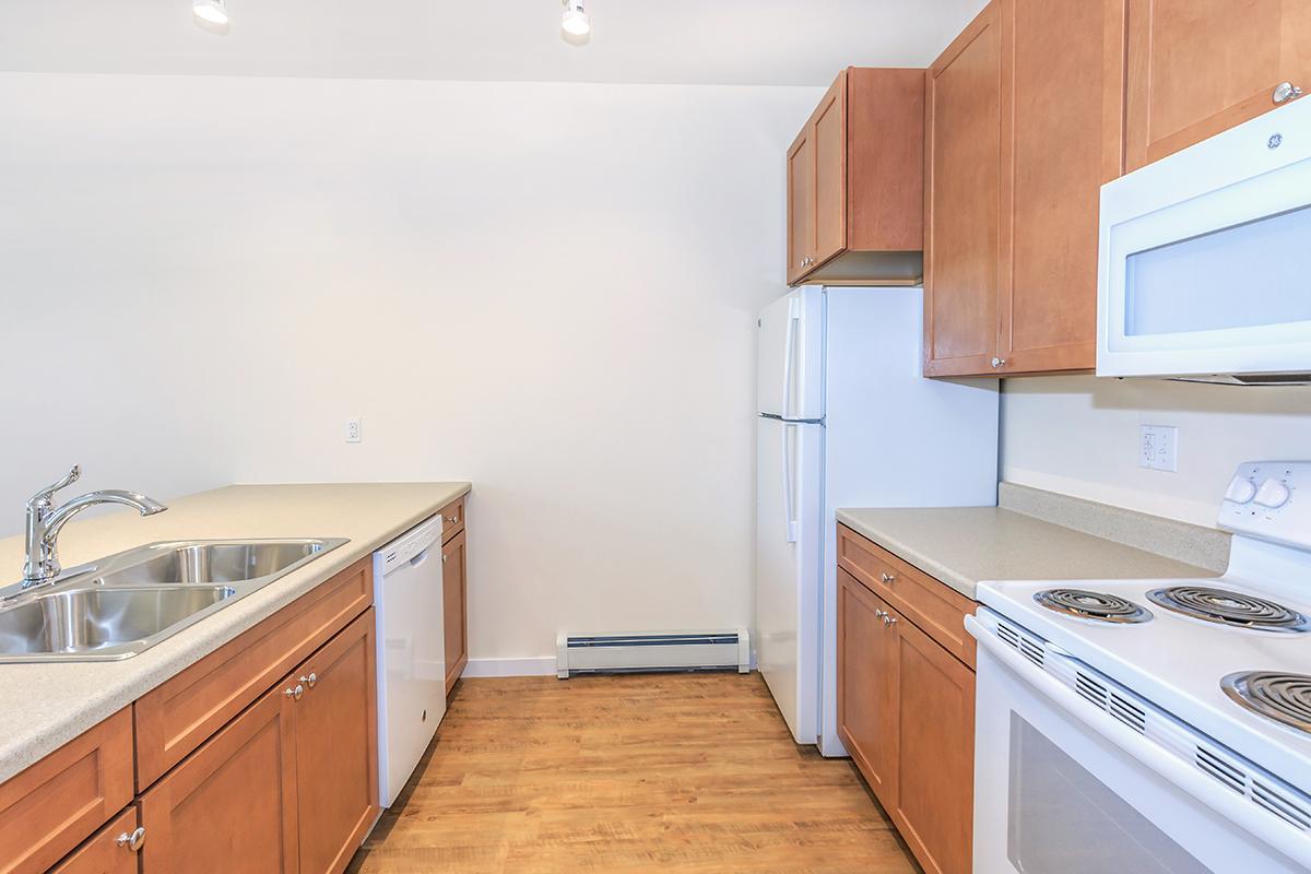 a kitchen with a stove top oven sitting inside of a refrigerator