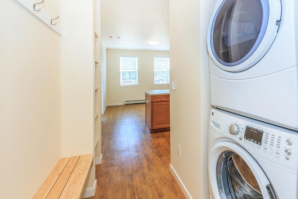 a large white tub next to a window