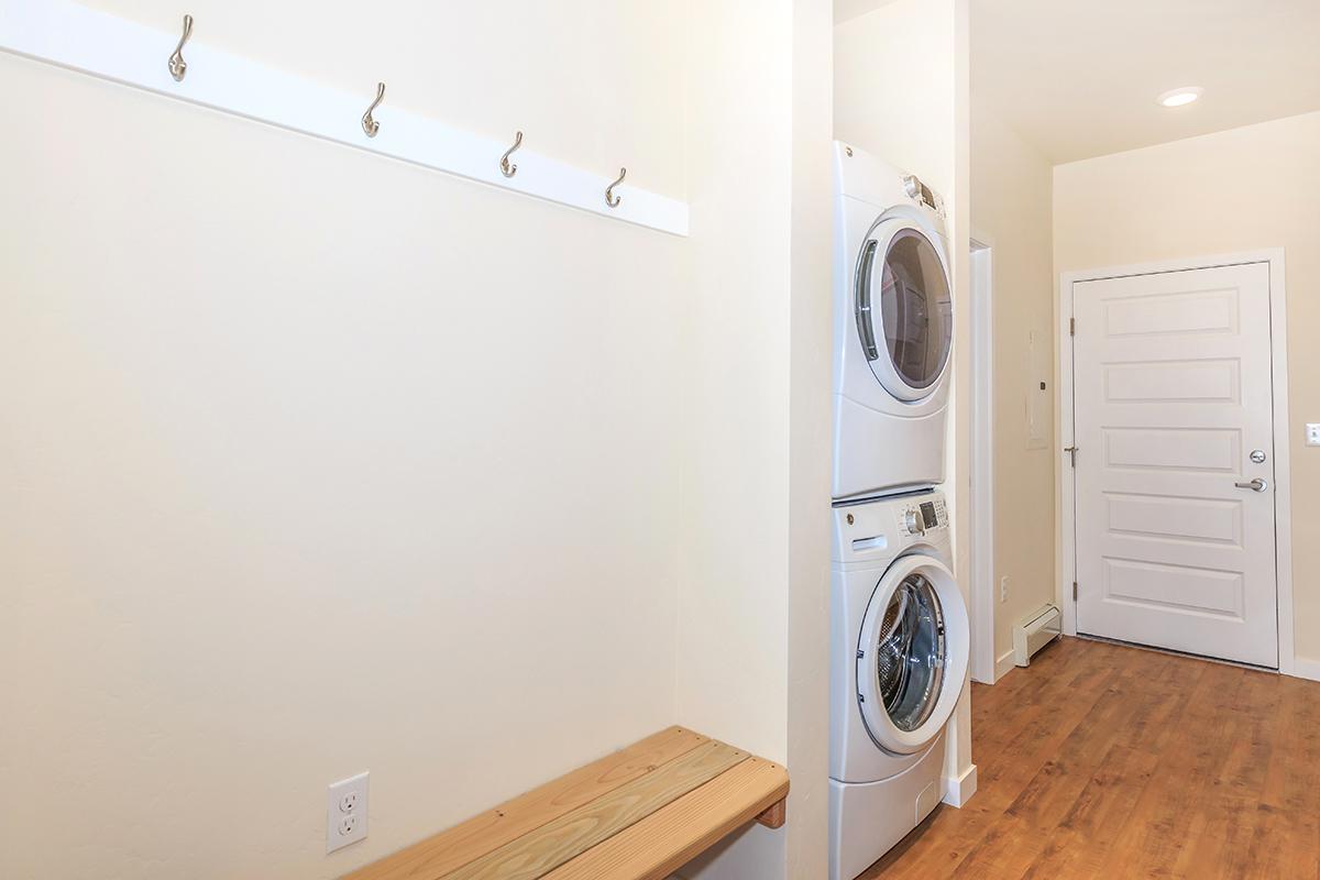 a white sink sitting next to a door