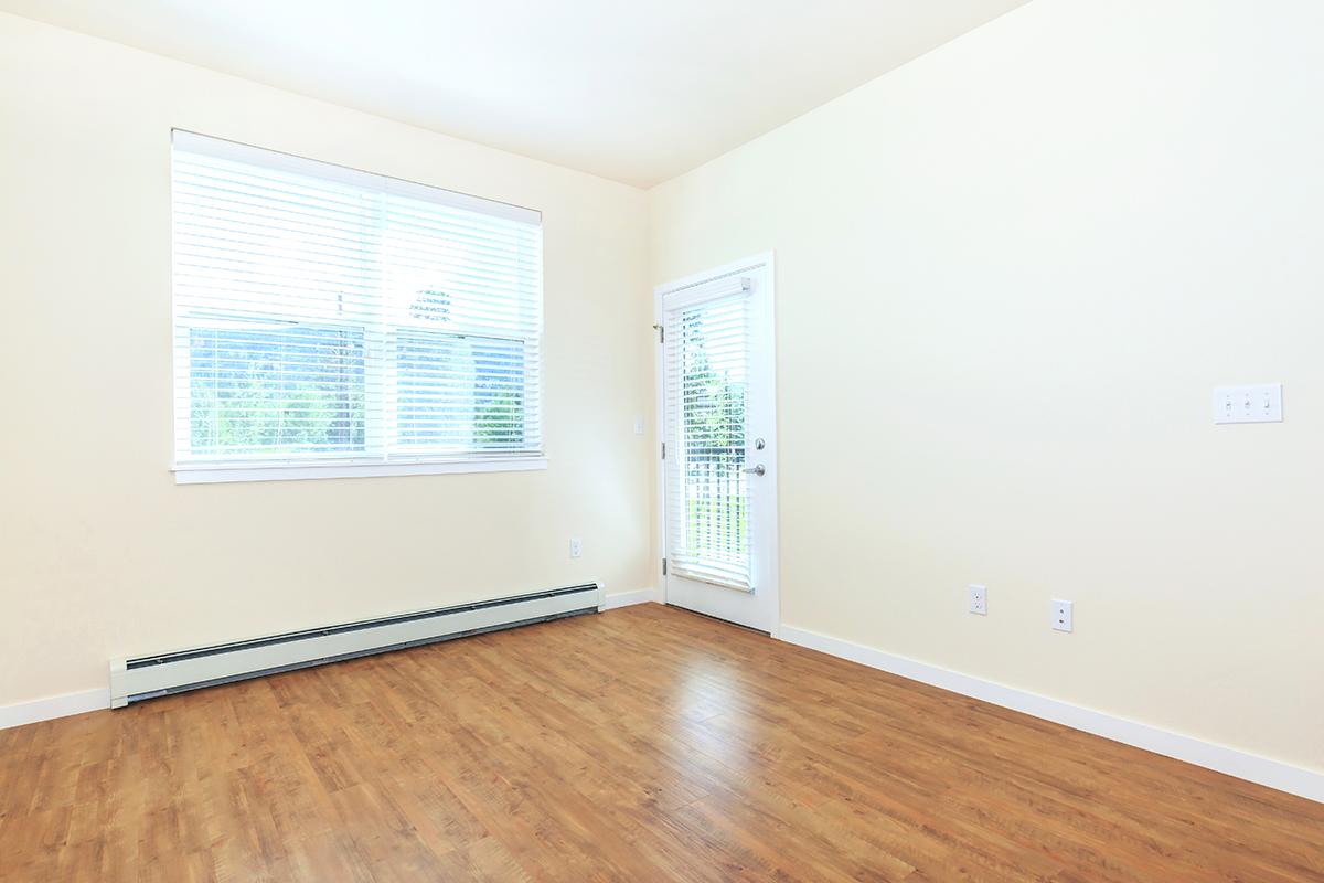 a flat screen tv sitting on top of a wooden floor