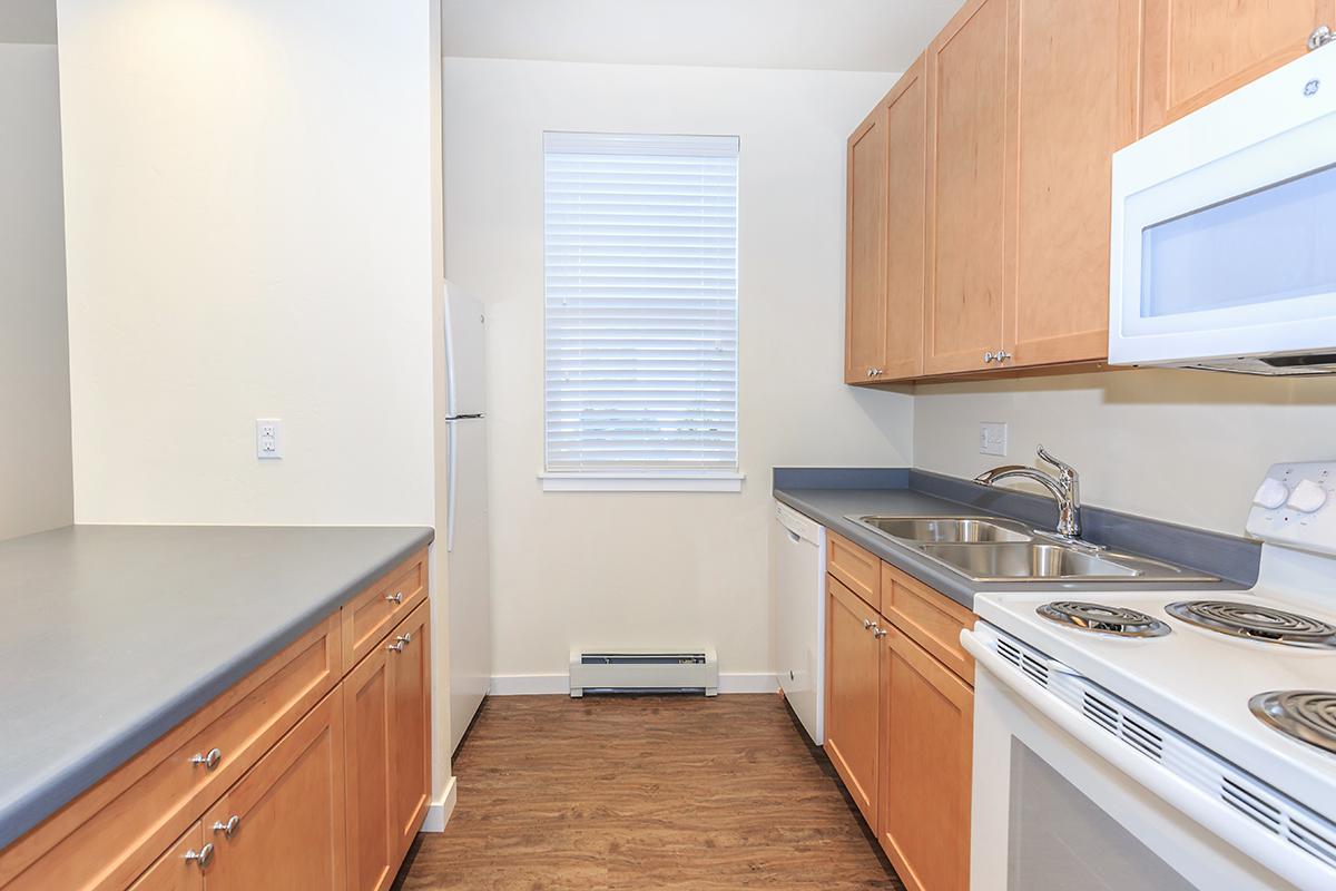 a kitchen with a stove top oven