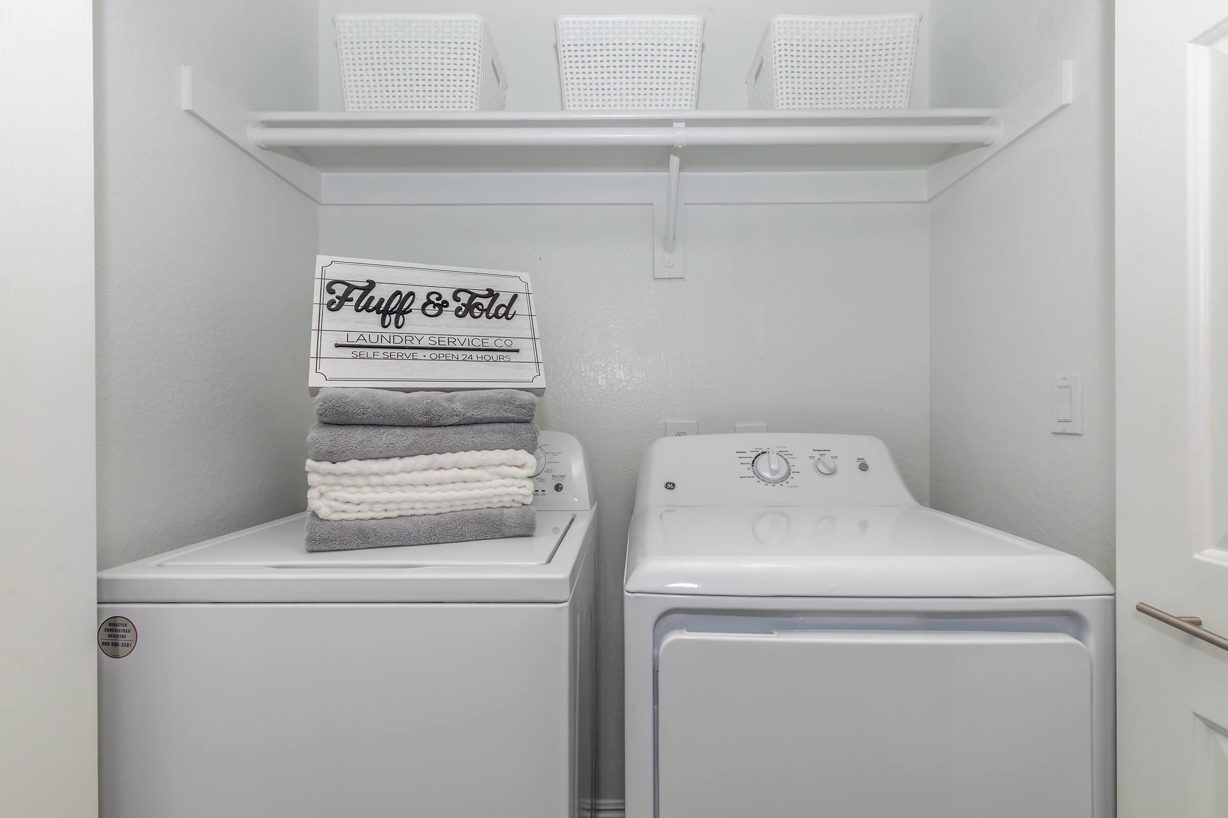 a microwave oven sitting on top of a refrigerator