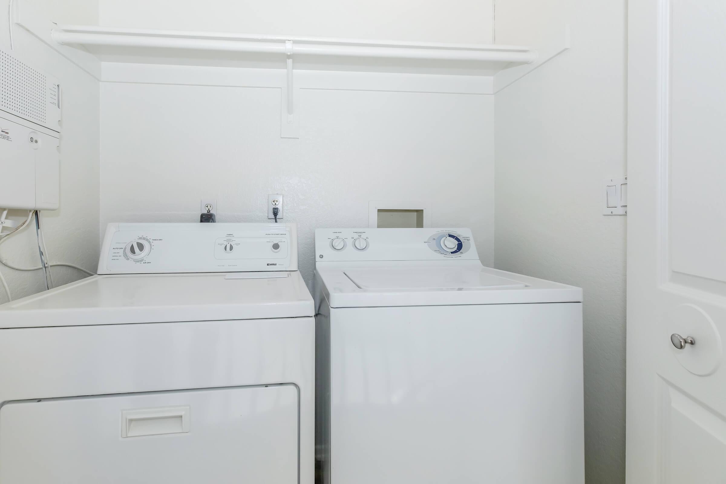 a kitchen with a sink and a refrigerator