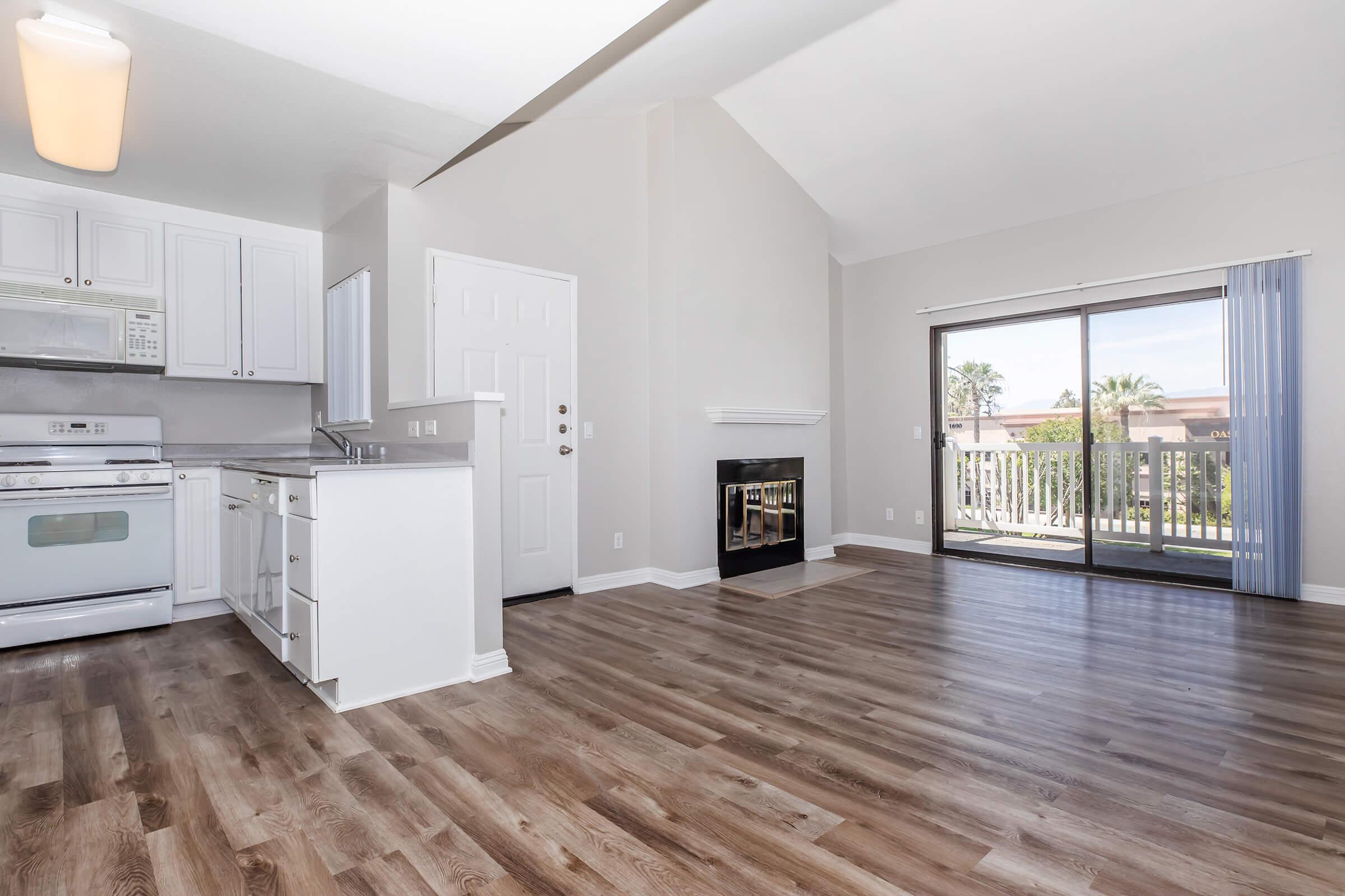 a kitchen with a wood floor