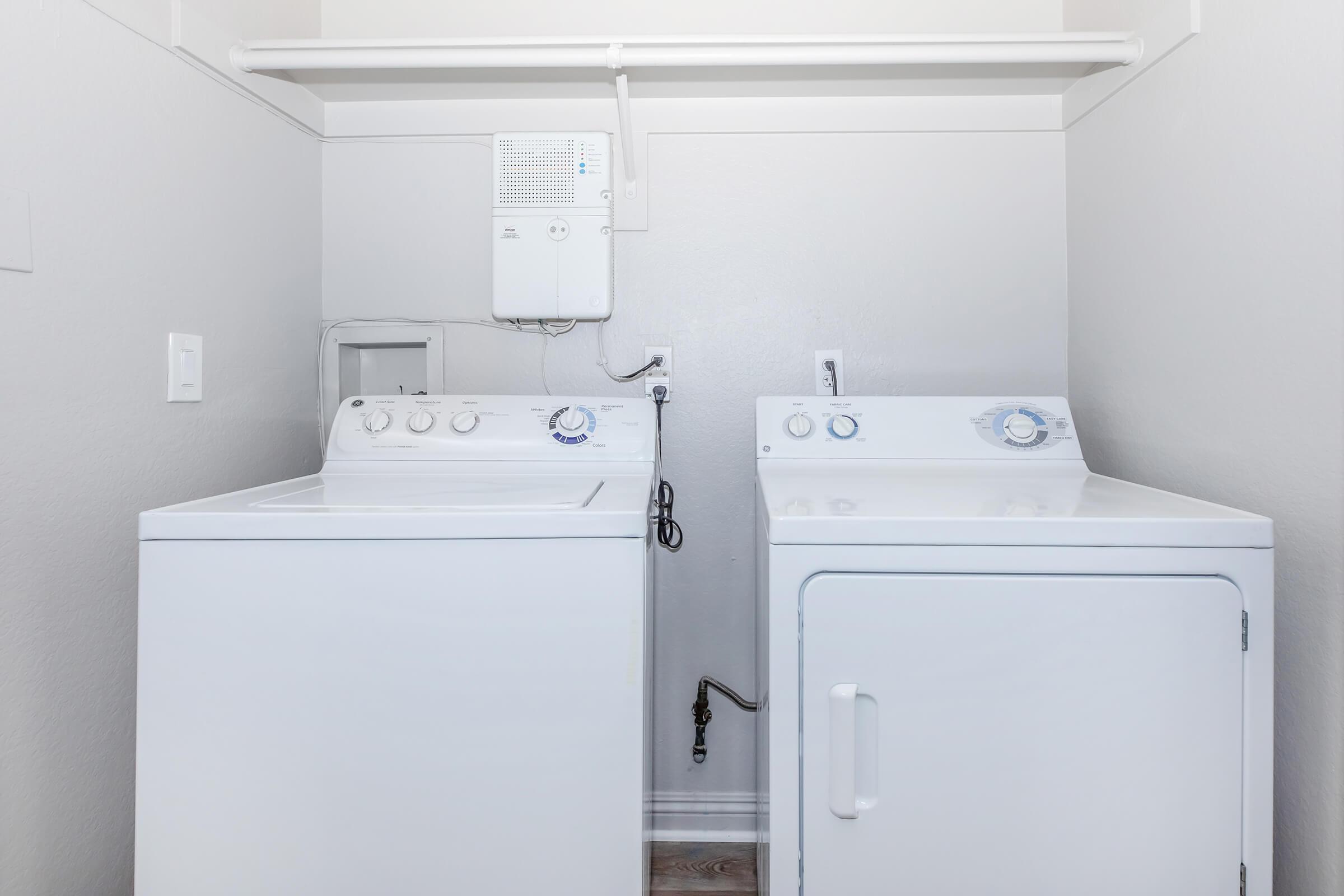 a refrigerator freezer sitting next to a sink