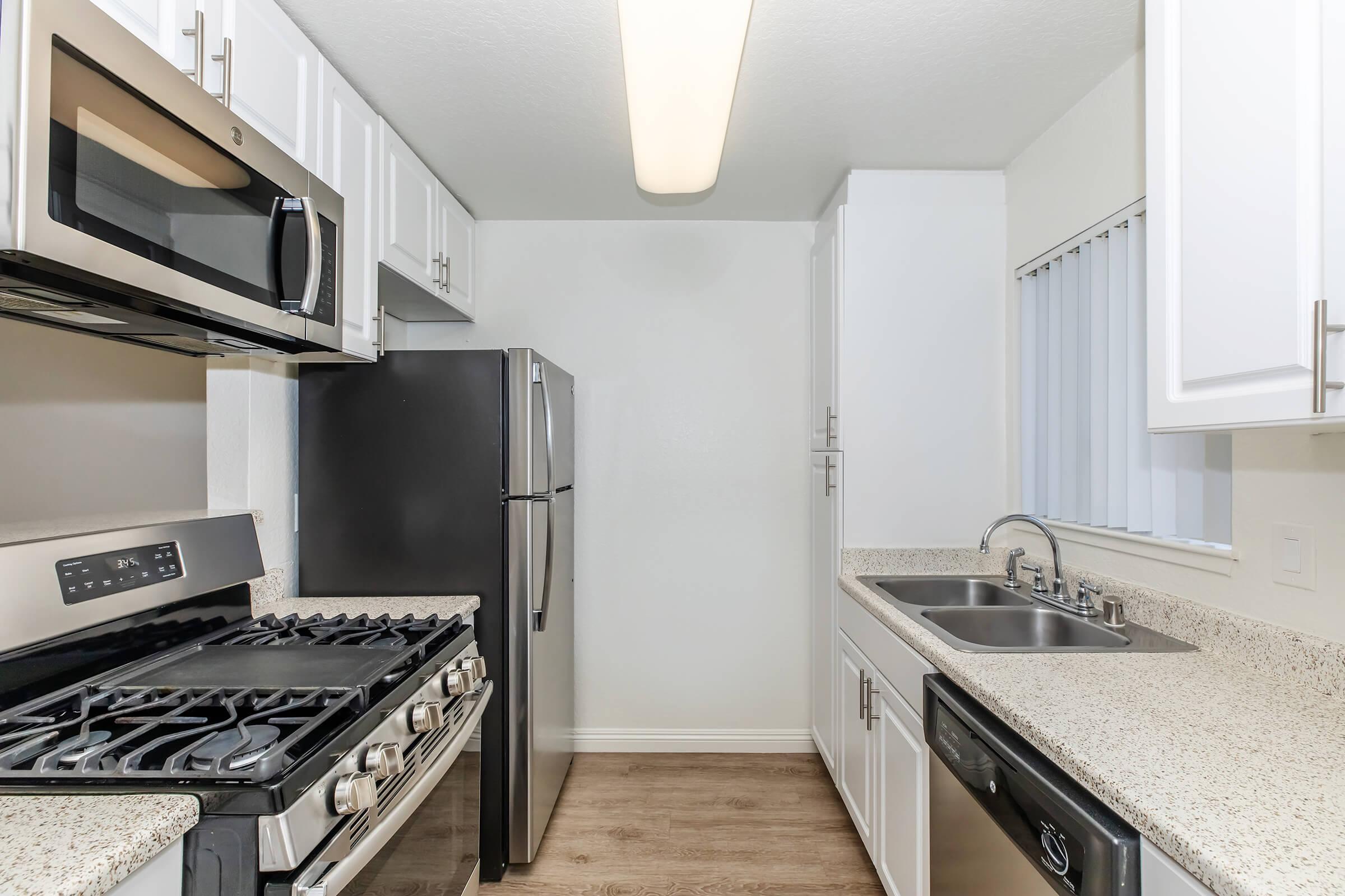 a kitchen with a stove top oven