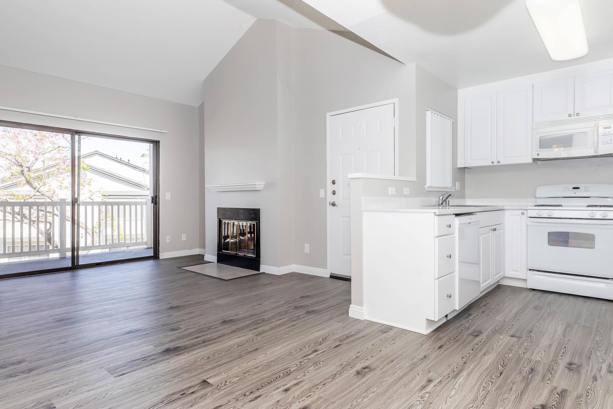 a kitchen with a wooden floor