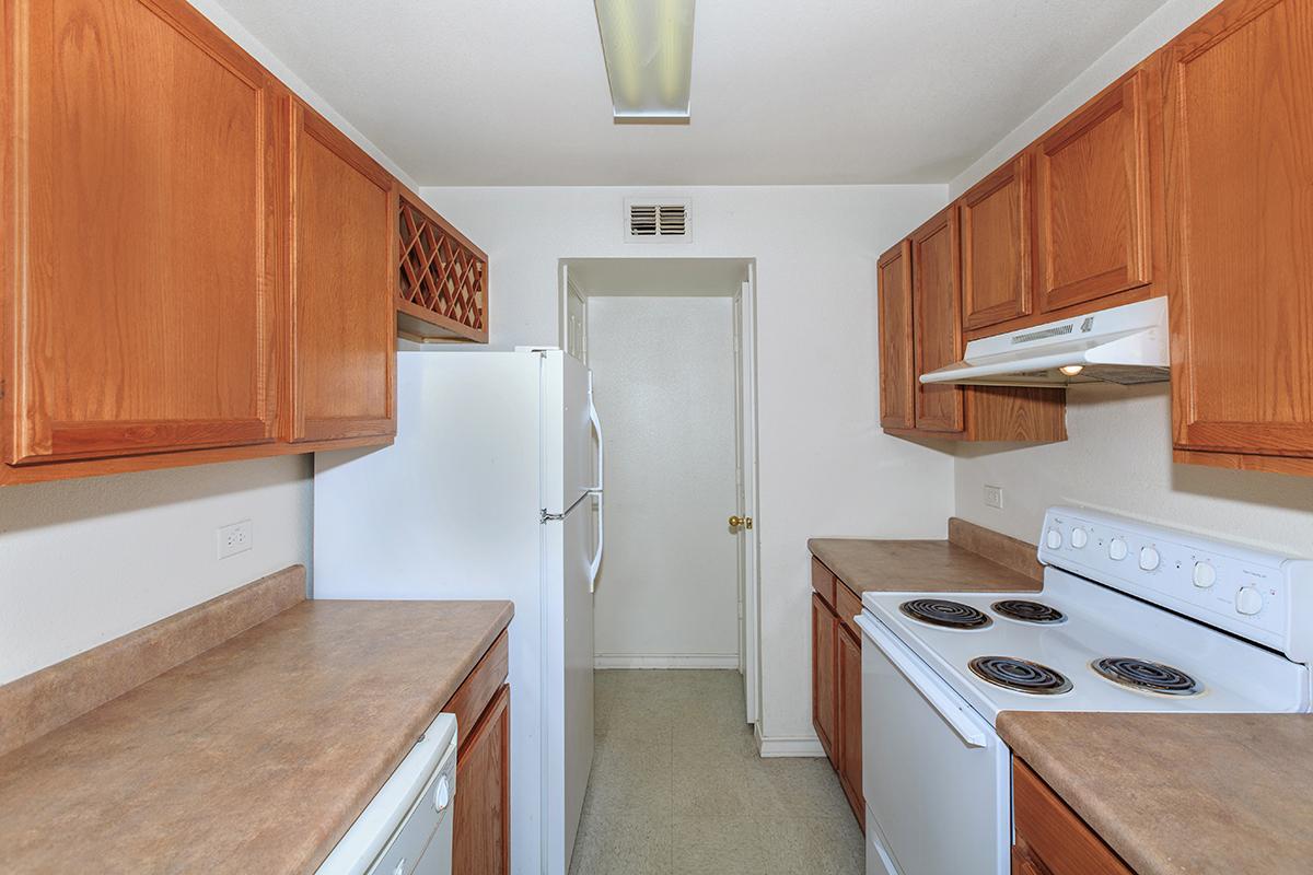 a kitchen with a stove top oven sitting inside of a refrigerator