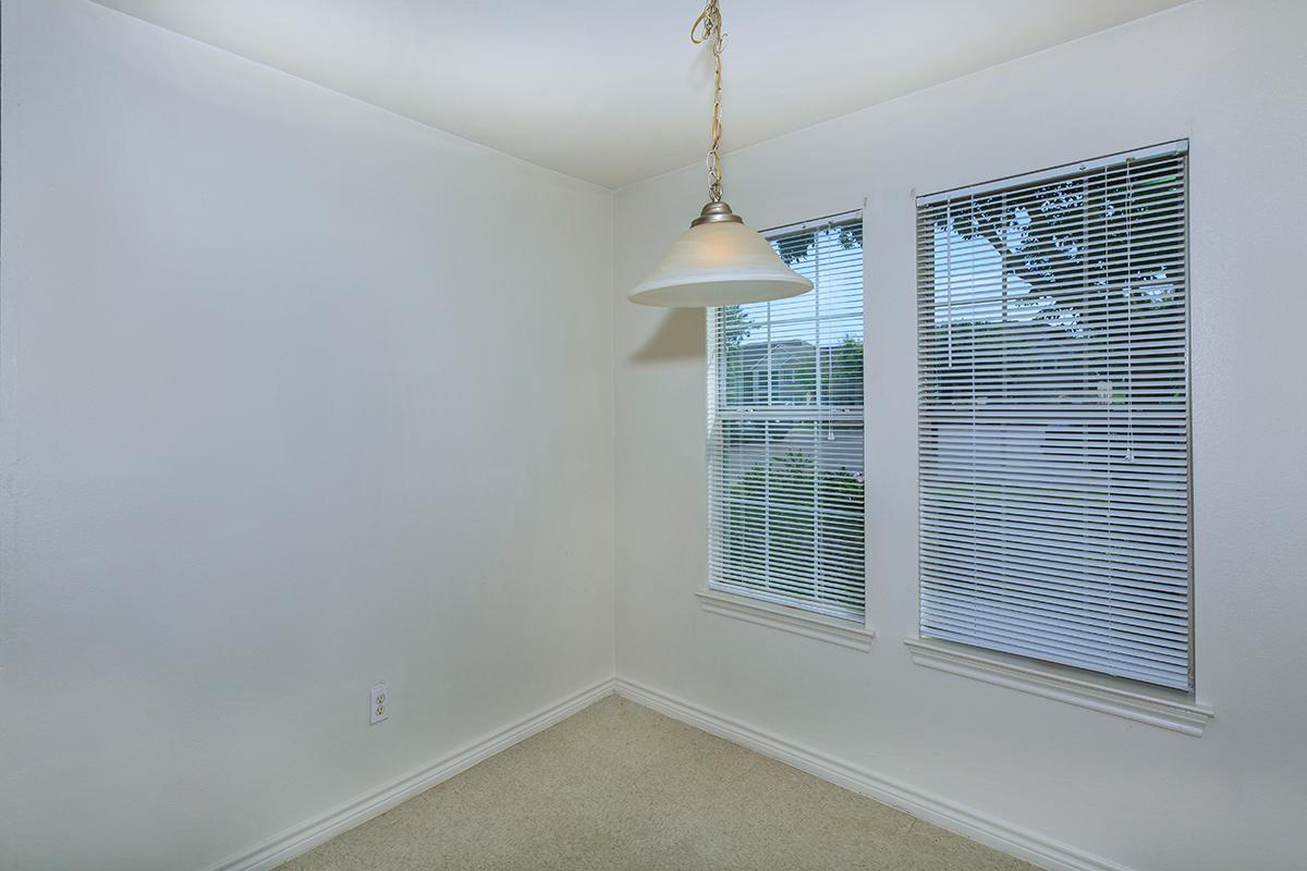 a corner of a room next to a window